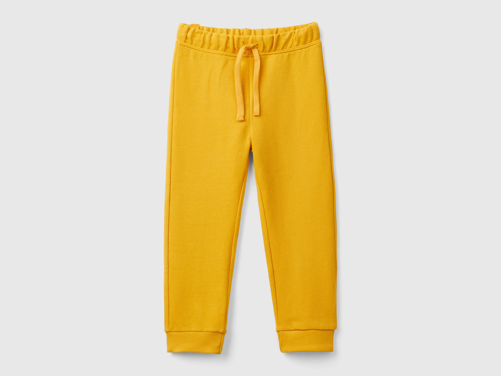 Joggers in felpa regular fit da bimbo senape | Benetton Outlet
