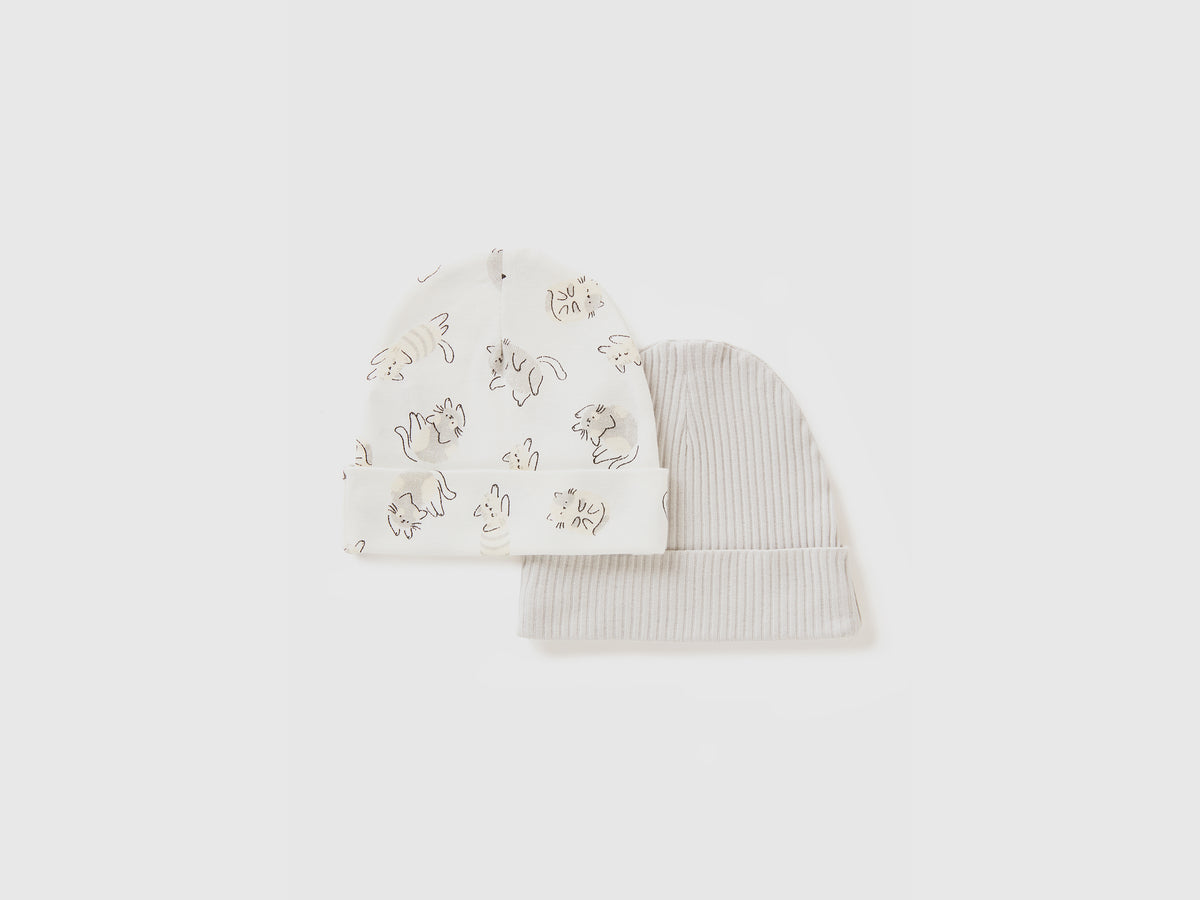 Due cappellini in cotone bio