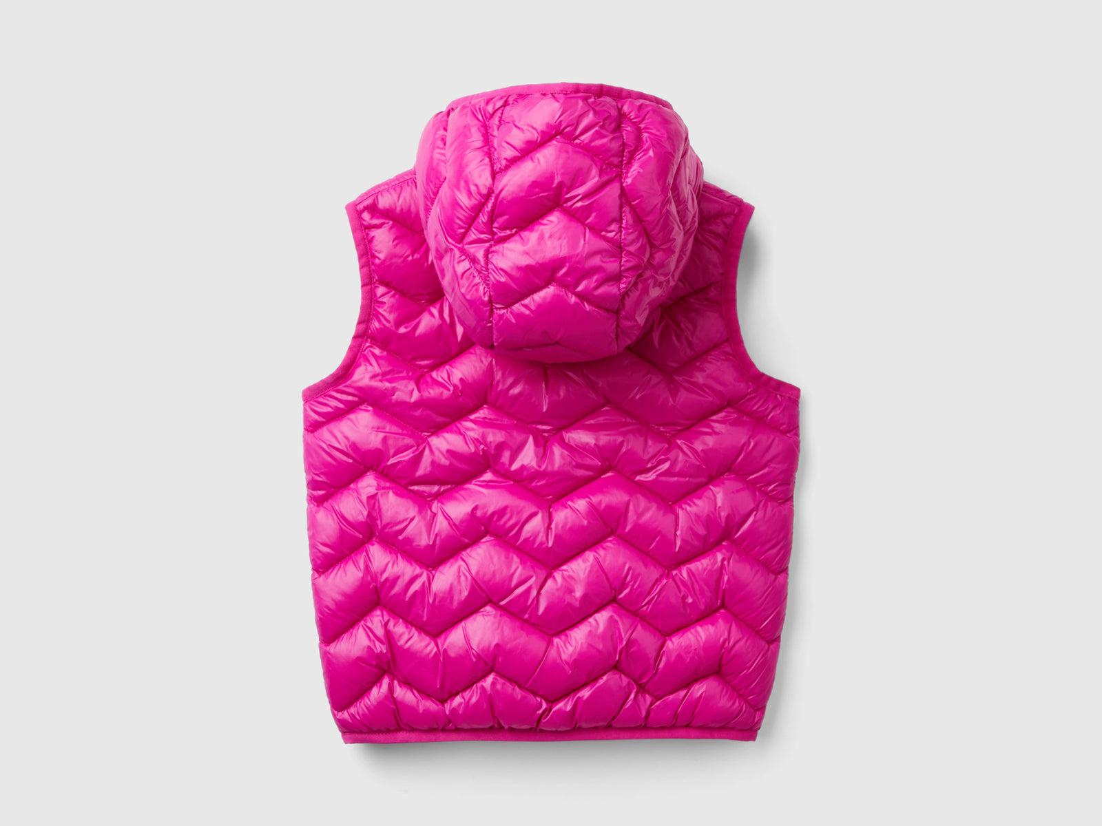 Gilet imbottito in ovatta 3D con cappuccio da bimba fucsia 2 | Benetton Outlet