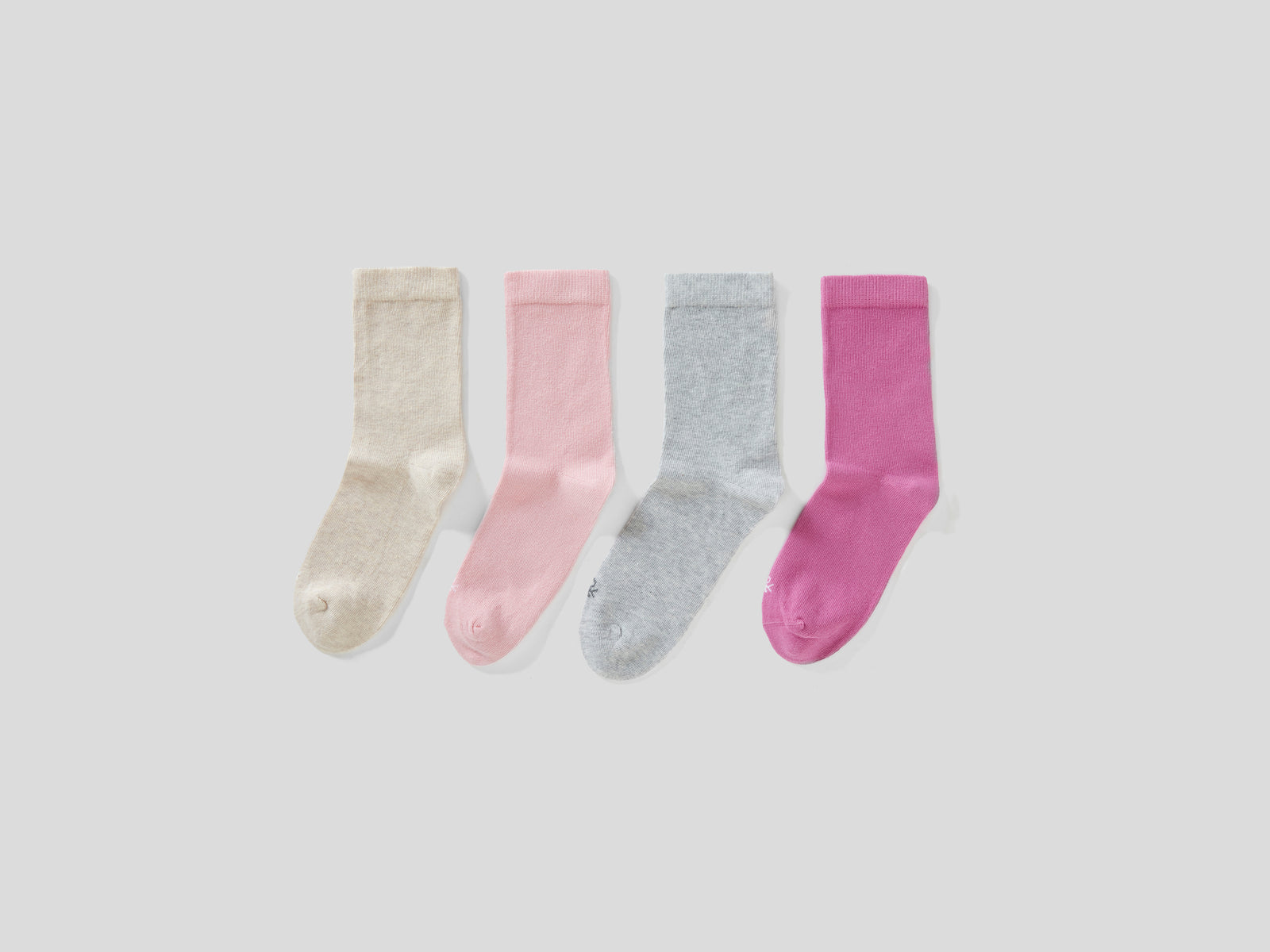 Quattro paia di calze in cotone  stretch da bambino multi-color | Benetton Outlet