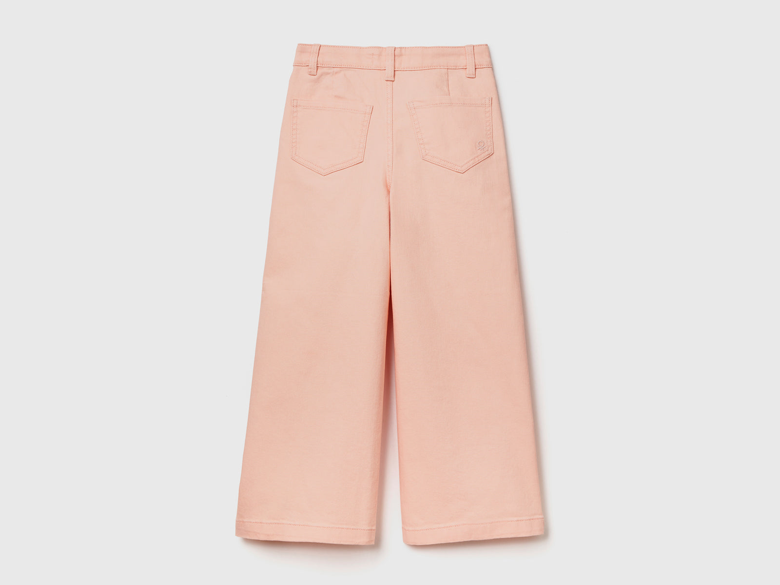 Pantaloni lunghi a vita alta in cotone elasticizzato da bambina rosa tenue 2 | Benetton Outlet