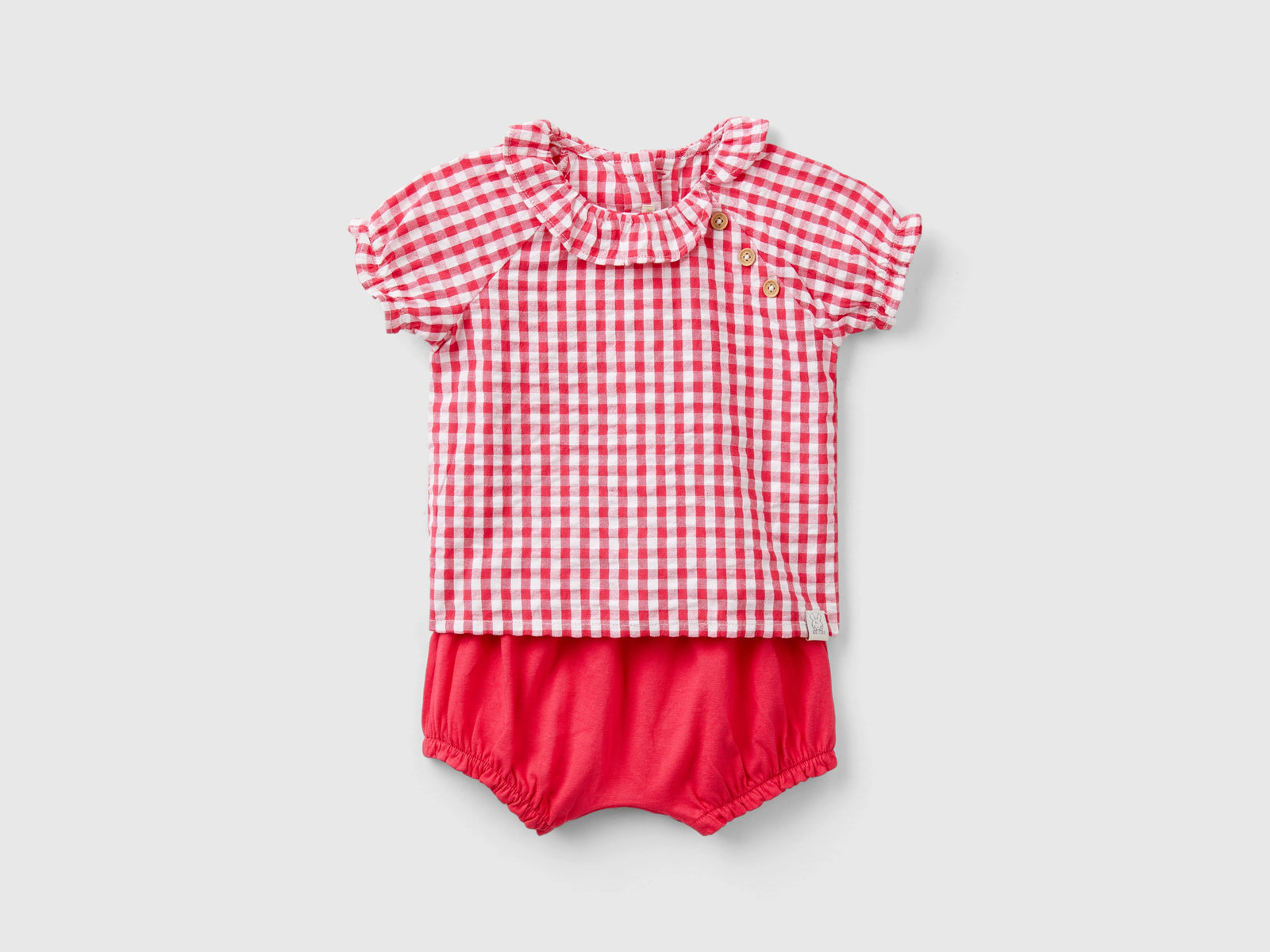 Completo t-shirt e pantaloni corti da neonato fucsia | Benetton Outlet