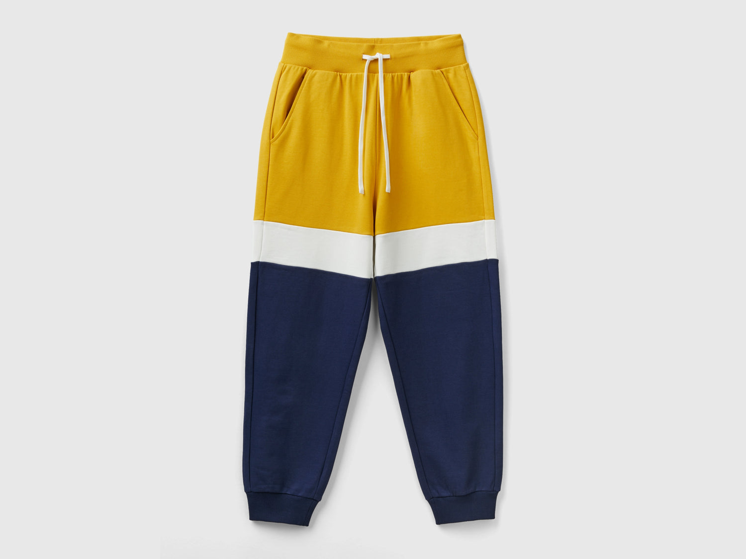 Joggers ocra e blu scuro da uomo giallo | Benetton Outlet