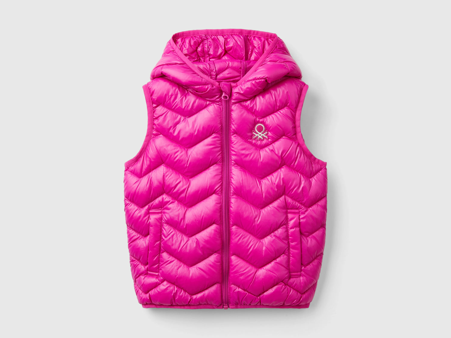Gilet imbottito in ovatta 3D con cappuccio da bimba fucsia | Benetton Outlet