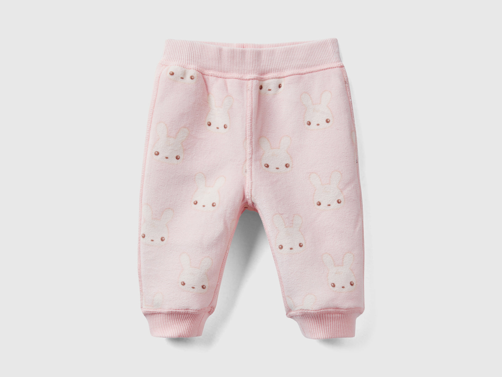 Pantaloni reversibili con coniglietti da neonato rosa tenue 2 | Benetton Outlet