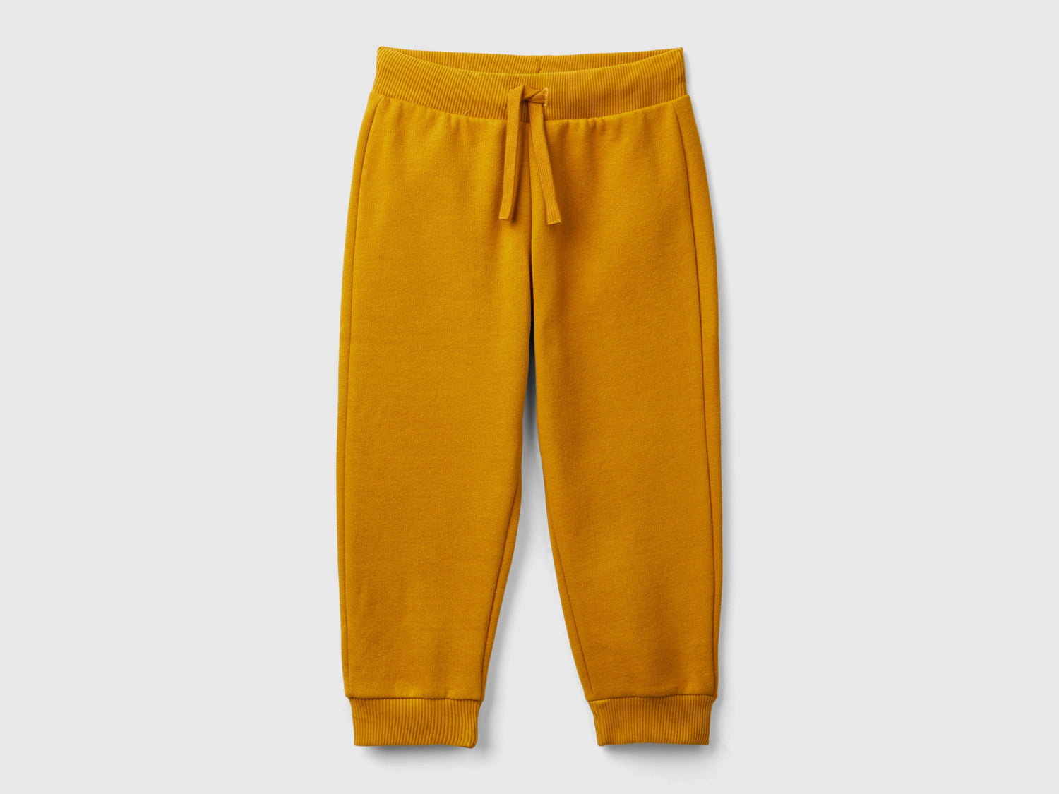 Joggers in calda felpa da bimbo senape | Benetton Outlet