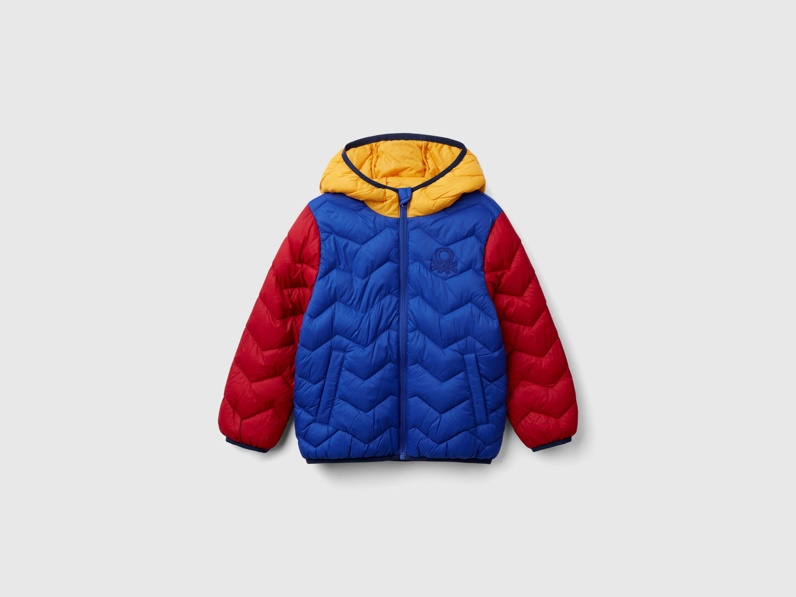Giubbotto imbottito con cappuccio da bimbo multi-color | Benetton Outlet