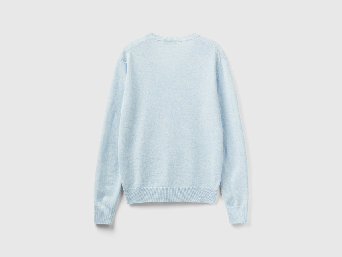 Maglia con scollo a V celeste in pura lana Merino