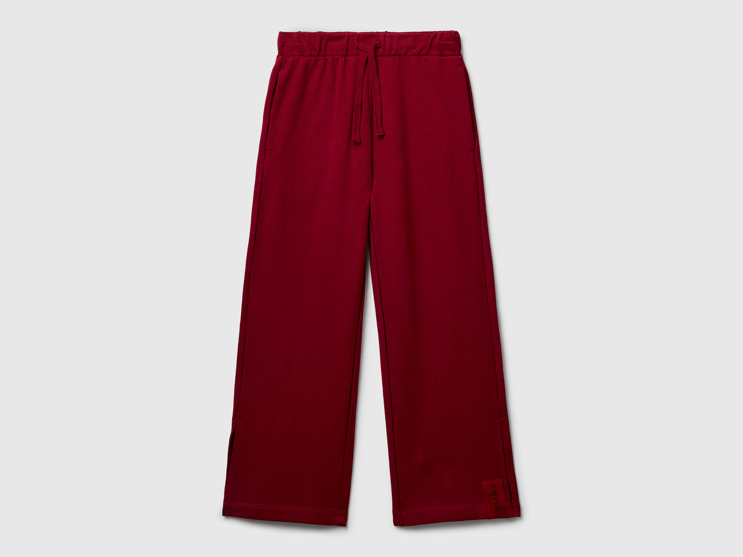 Pantaloni ampi in felpa da bambina bordeaux | Benetton Outlet