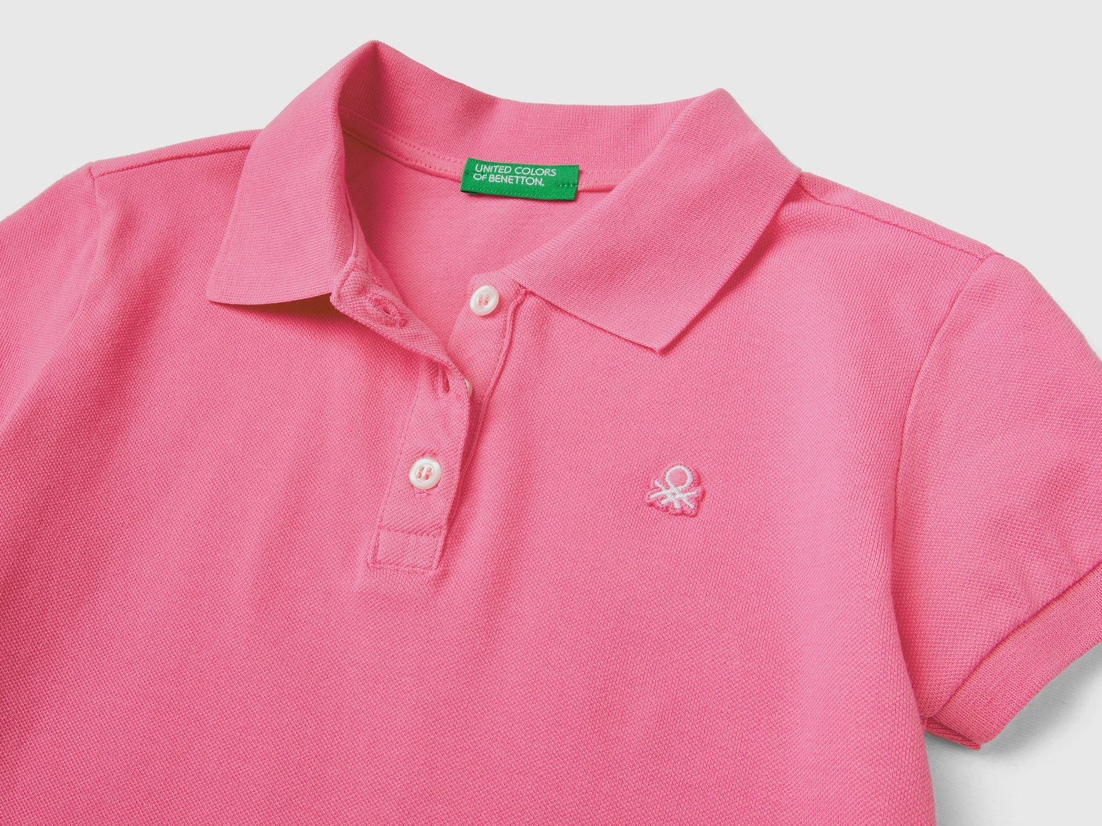 Polo a manica corta in piquet di cotone elasticizzato da bambina rosa 2 | Benetton Outlet