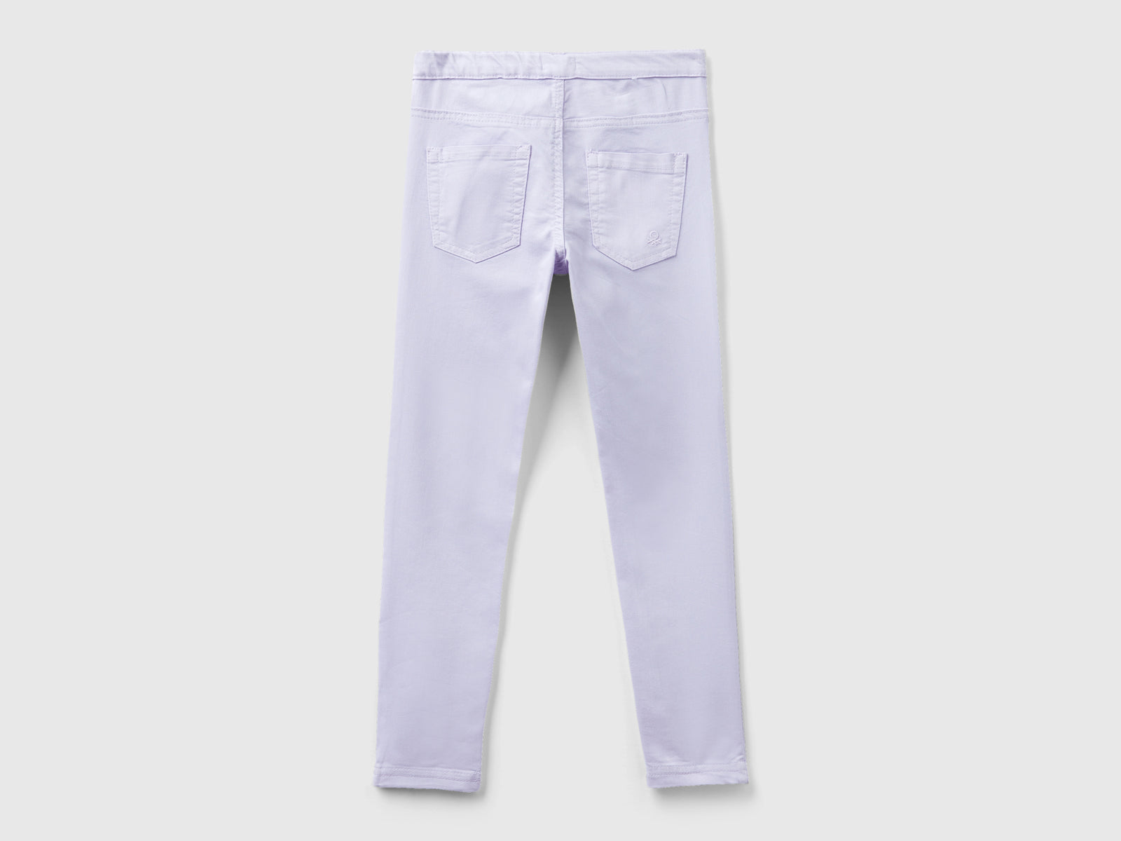 Pantaloni super skinny da bambina lilla 2 | Benetton Outlet