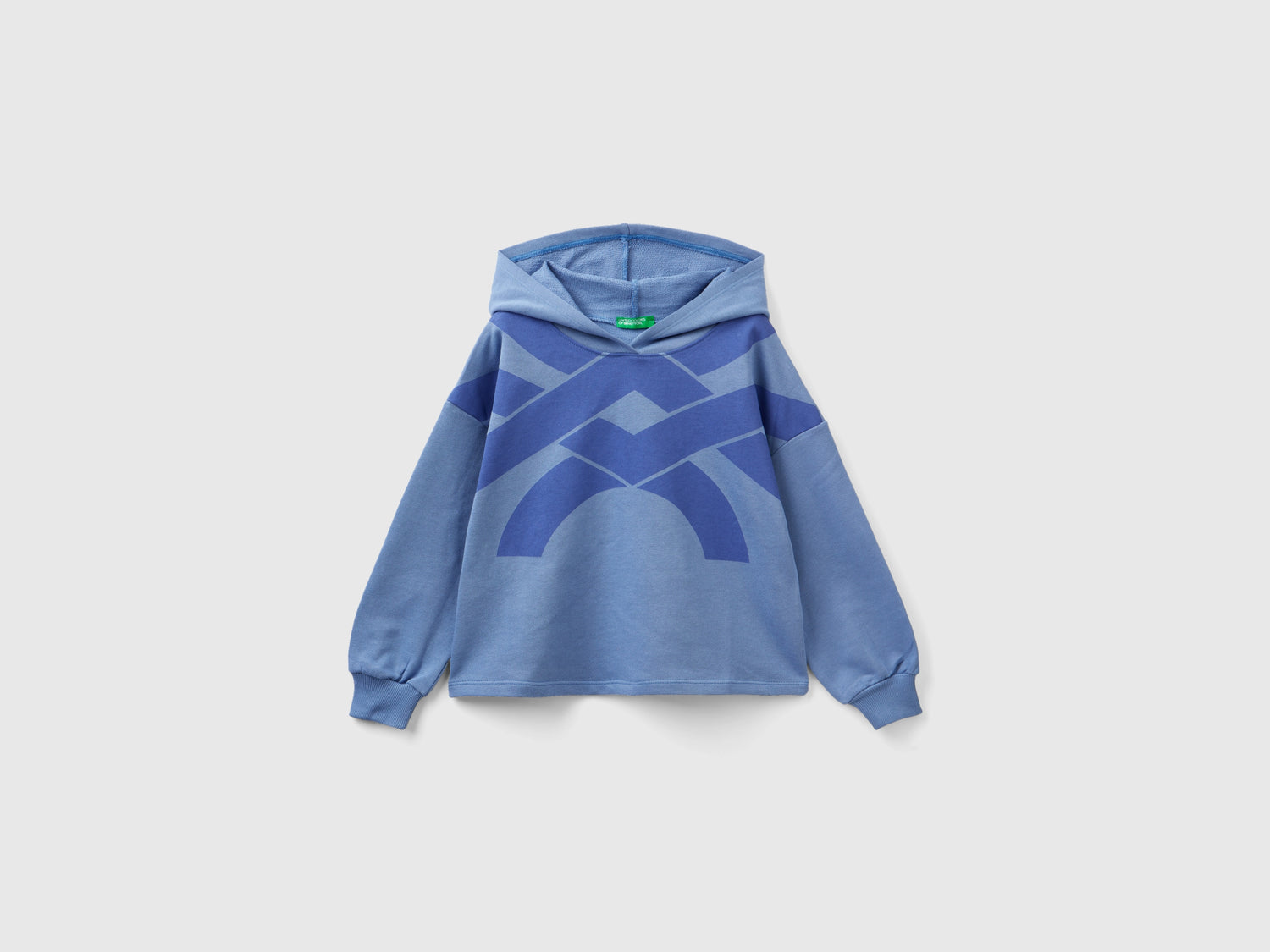 Felpa over fit con cappuccio da bambina azzurro | Benetton Outlet