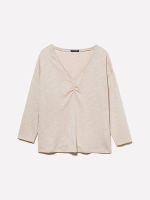 T-shirt rosa chiaro con arriccio
