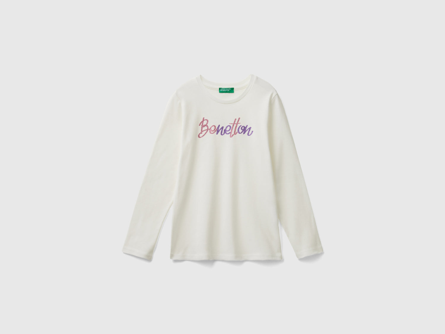 T-shirt manica lunga con stampa glitter da bambina bianco panna | Benetton Outlet