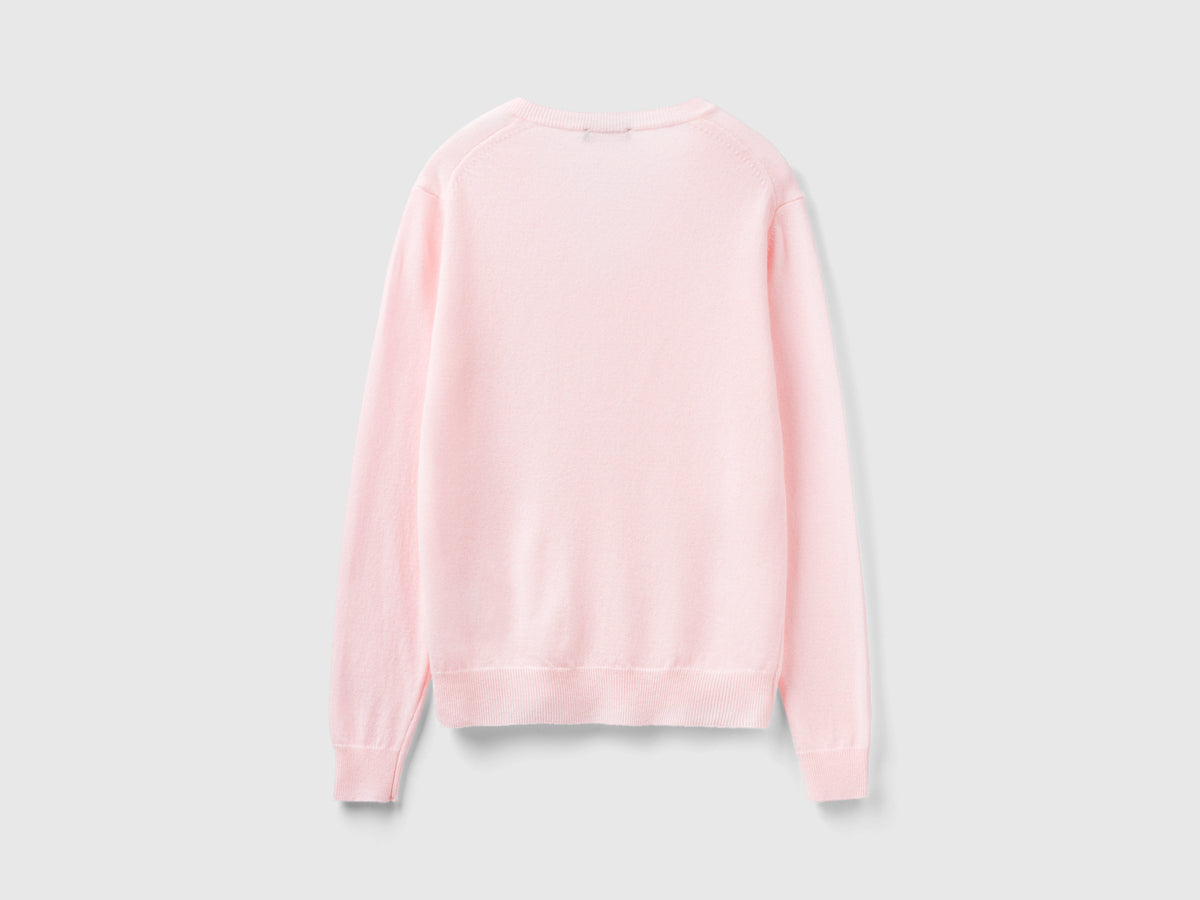 Maglia con scollo a V rosa chiaro in pura lana Merino