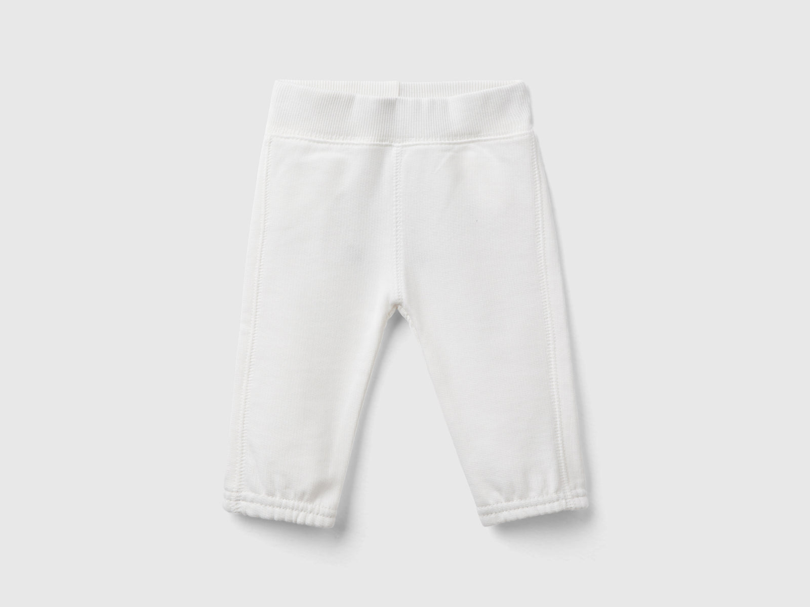 Pantaloni in felpa di cotone bio da neonato bianco panna | Benetton Outlet