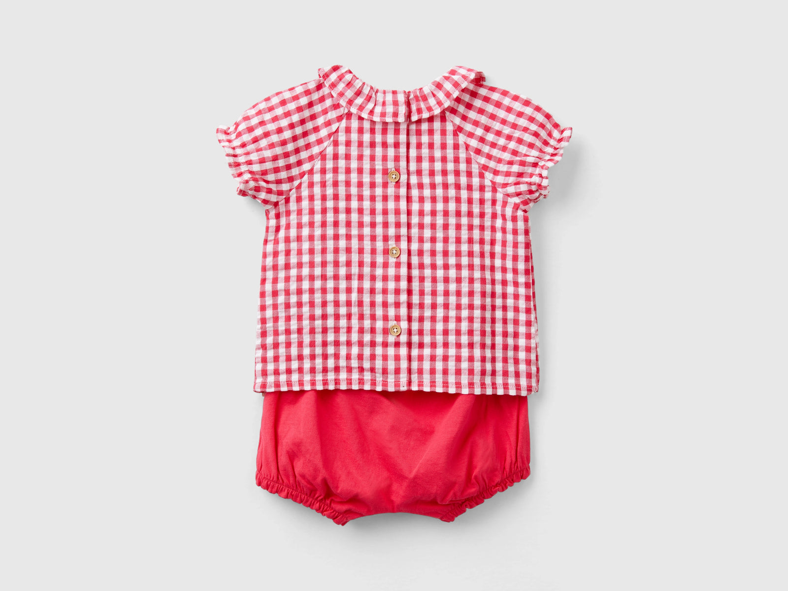 Completo t-shirt e pantaloni corti da neonato fucsia 2 | Benetton Outlet