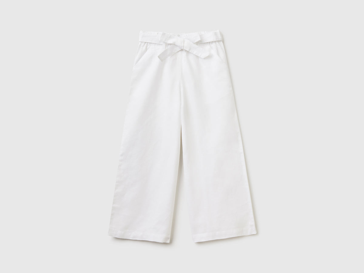 Pantaloni lunghi palazzo in misto lino e cotone da bambina bianco | Benetton Outlet