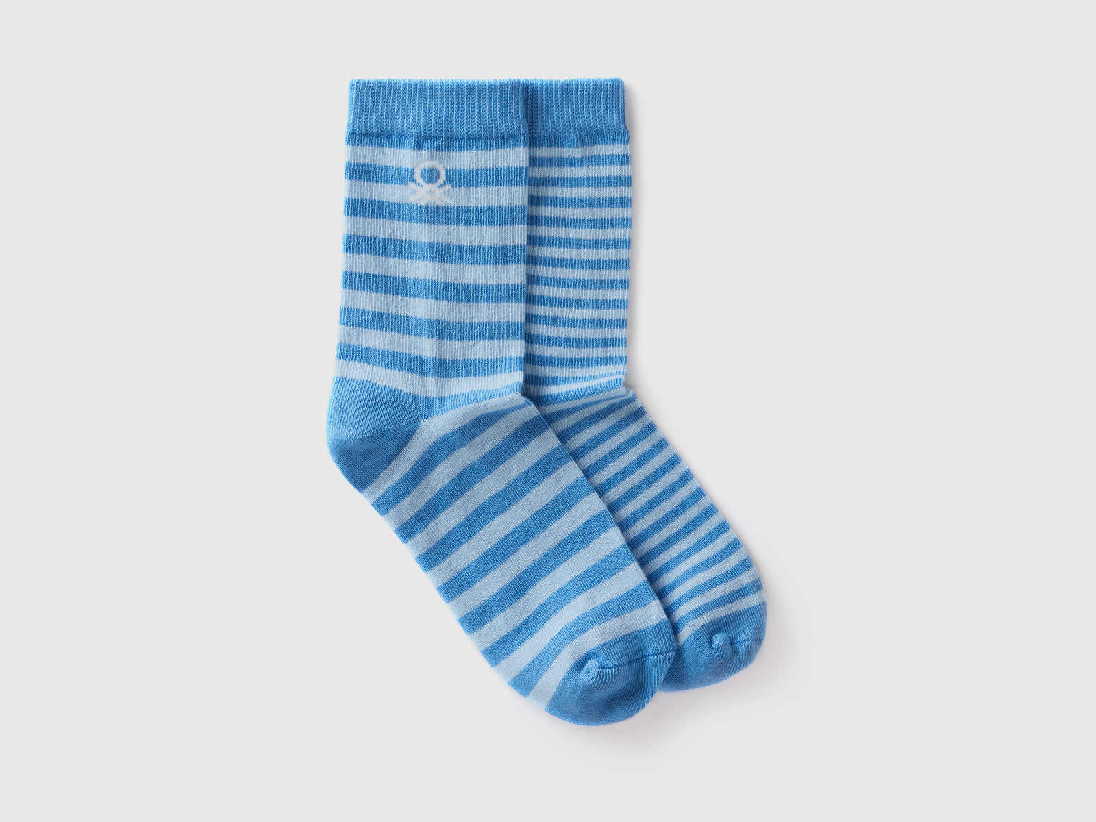 Calzini lunghi mix & match a righe da bambino azzurro | Benetton Outlet