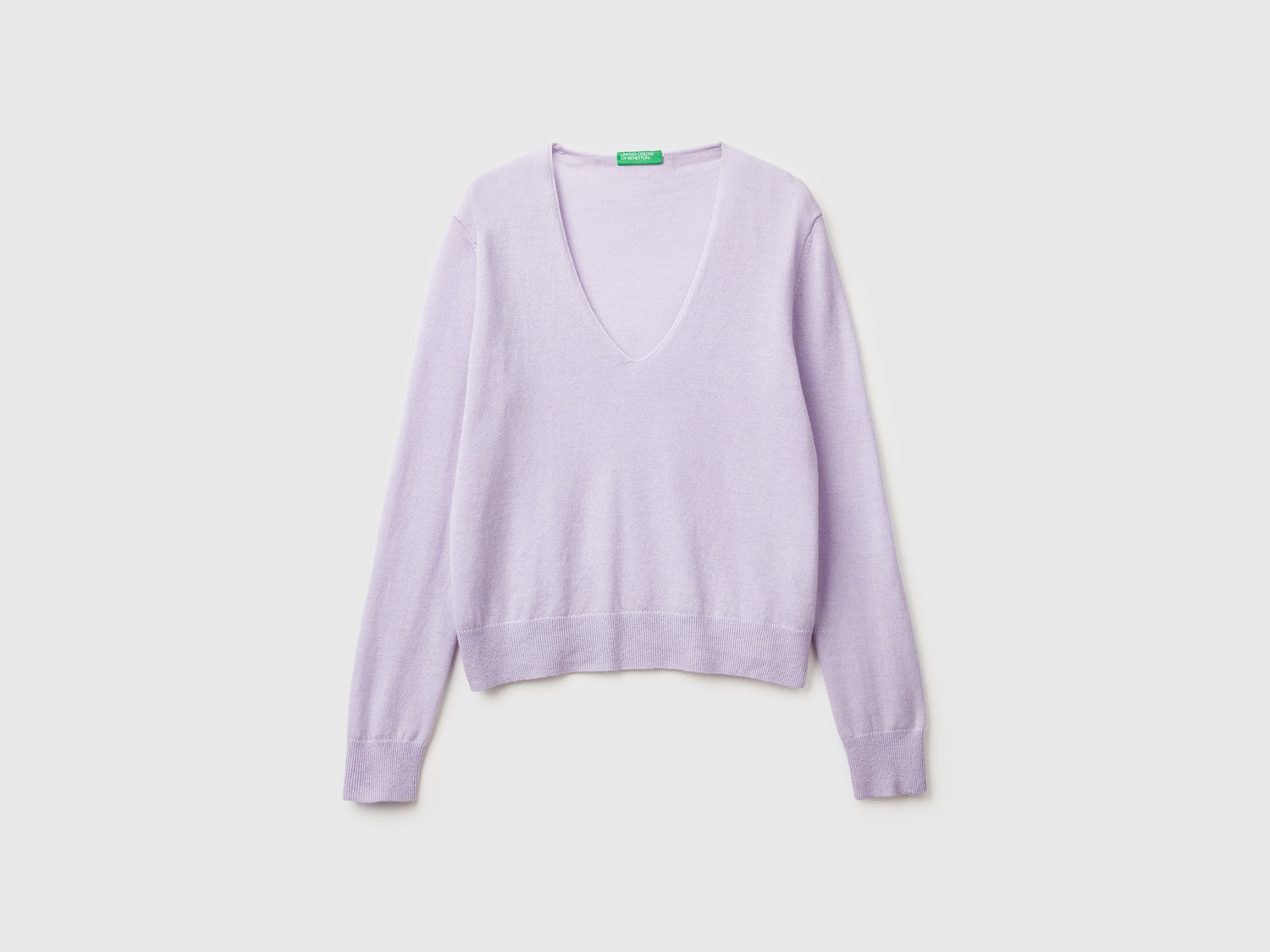 Maglione con scollo a V in pura lana Merino da donna lilla | Benetton Outlet