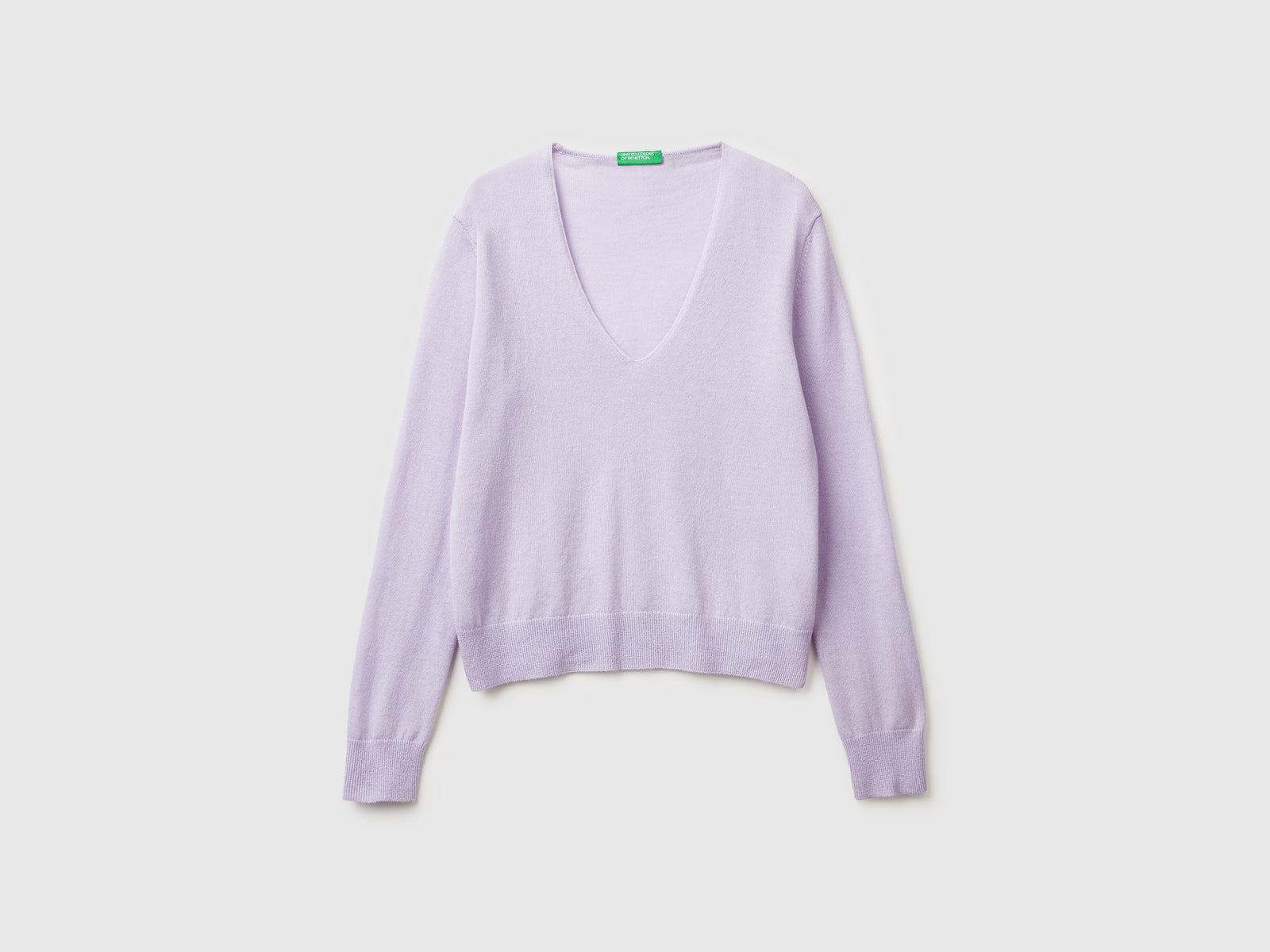 Maglione con scollo a V in pura lana Merino da donna lilla | Benetton Outlet