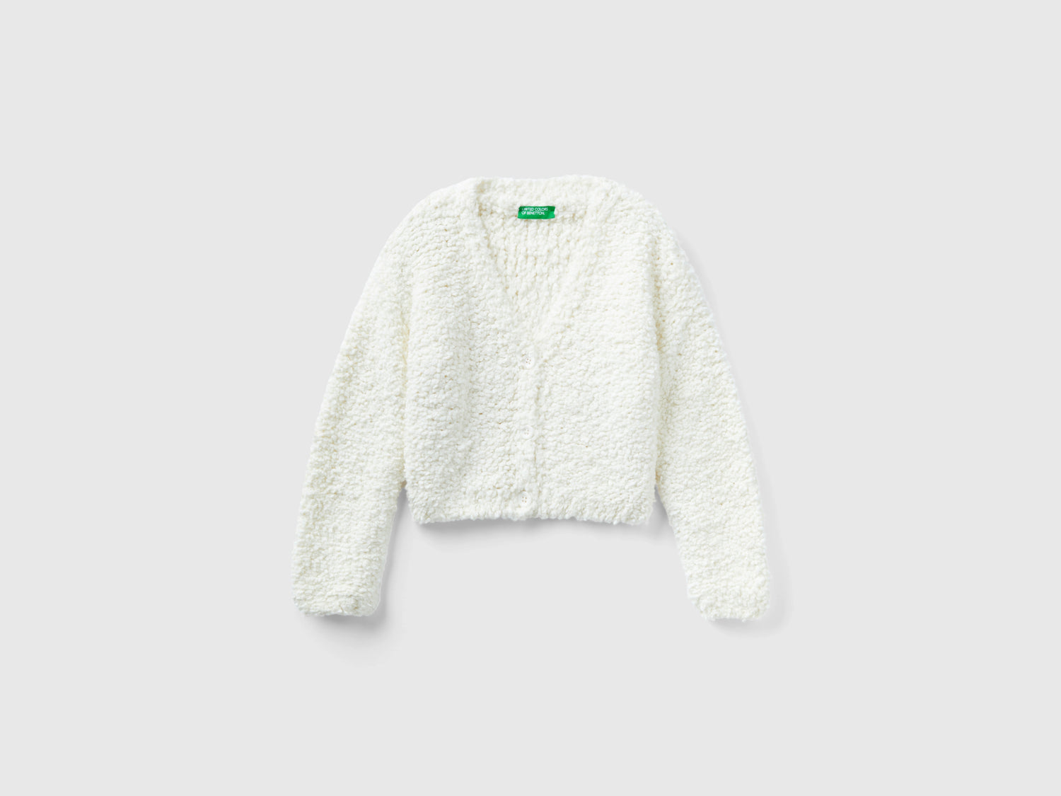 Cardigan bouclé con scollo a V da bambina bianco | Benetton Outlet