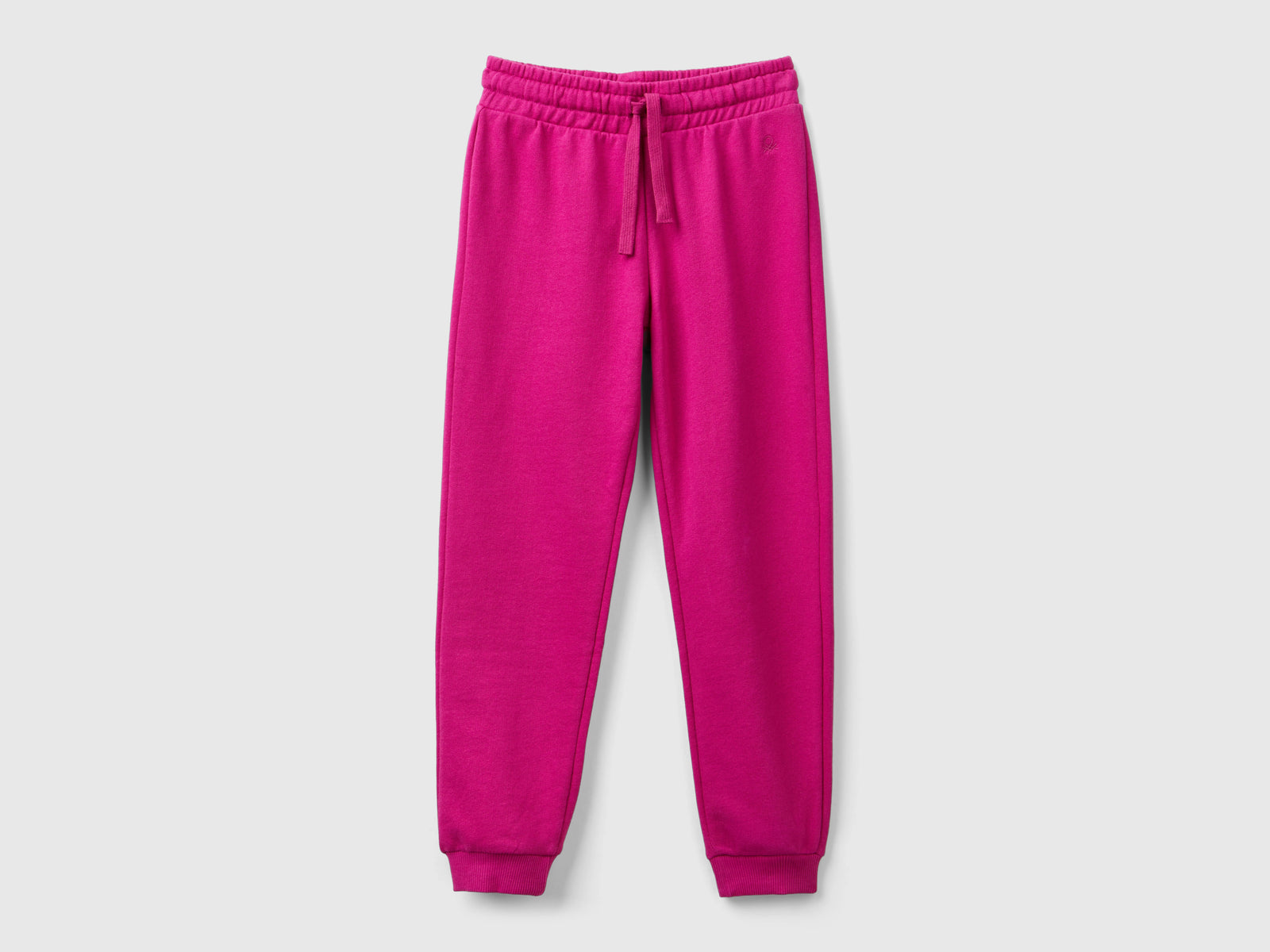 Pantaloni in felpa con logo da bambina fucsia | Benetton Outlet