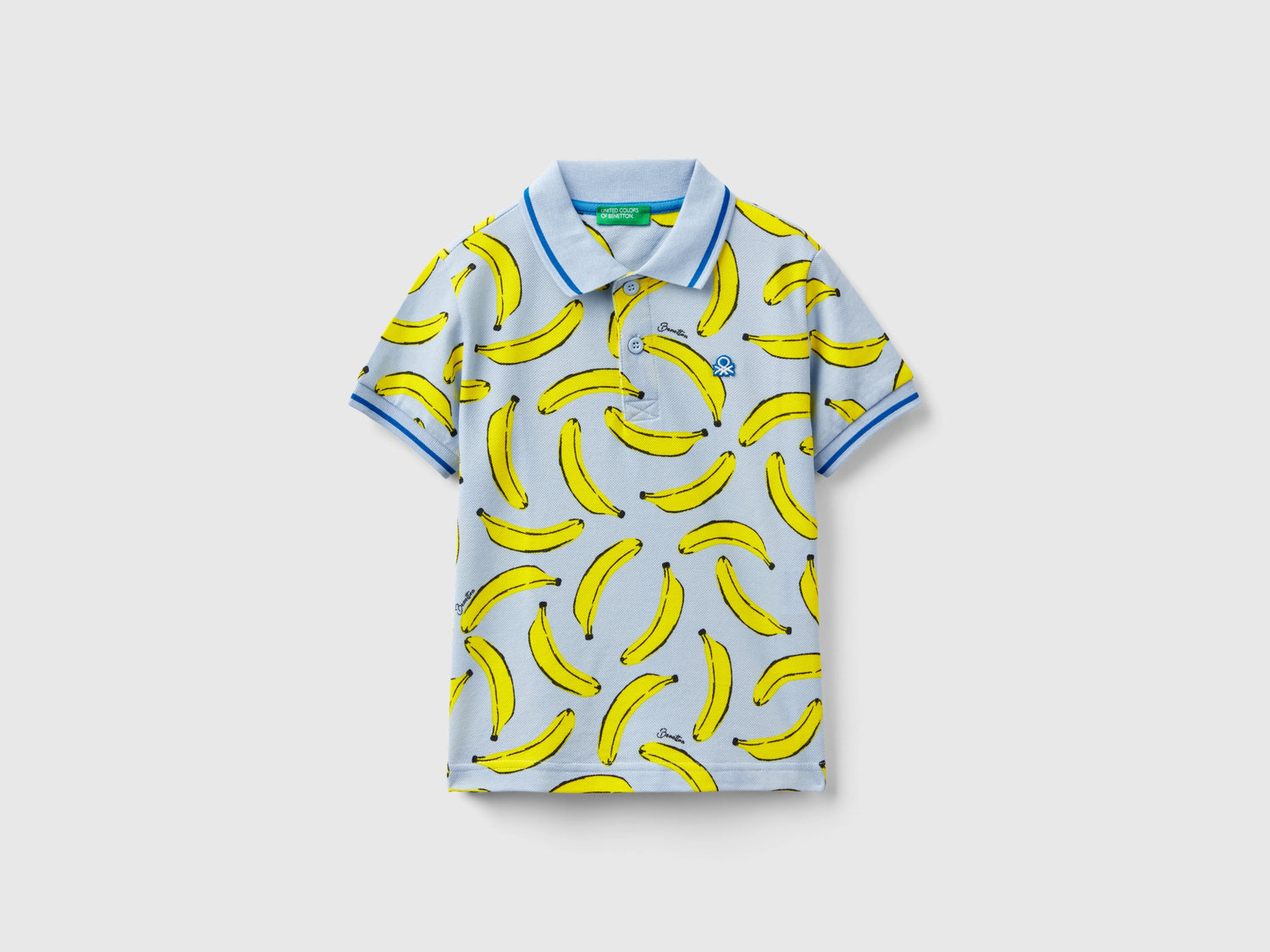 Polo con pattern banane da bimbo celeste | Benetton Outlet