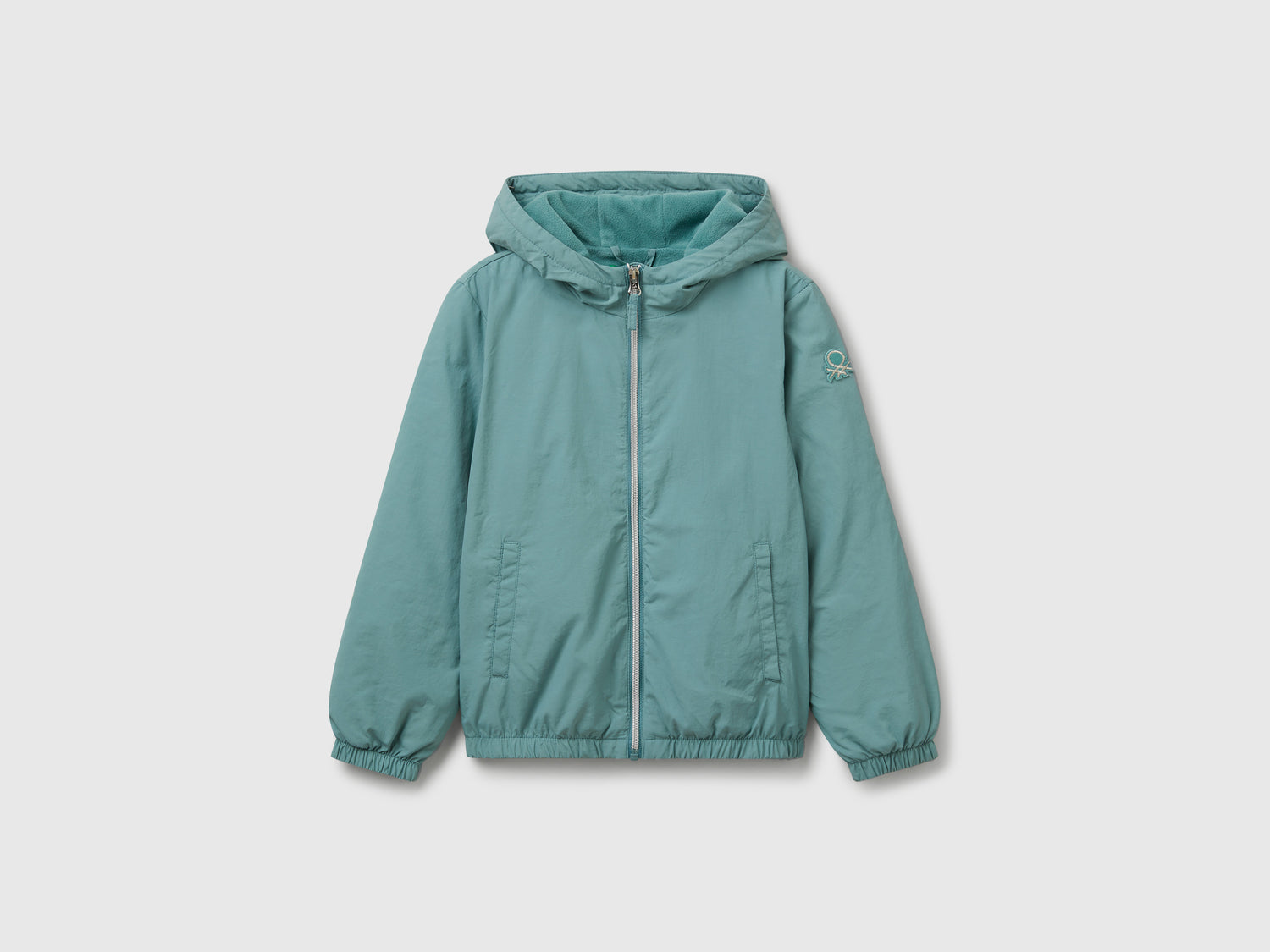 Giacca leggera "Rain Defender" da bambina celeste | Benetton Outlet
