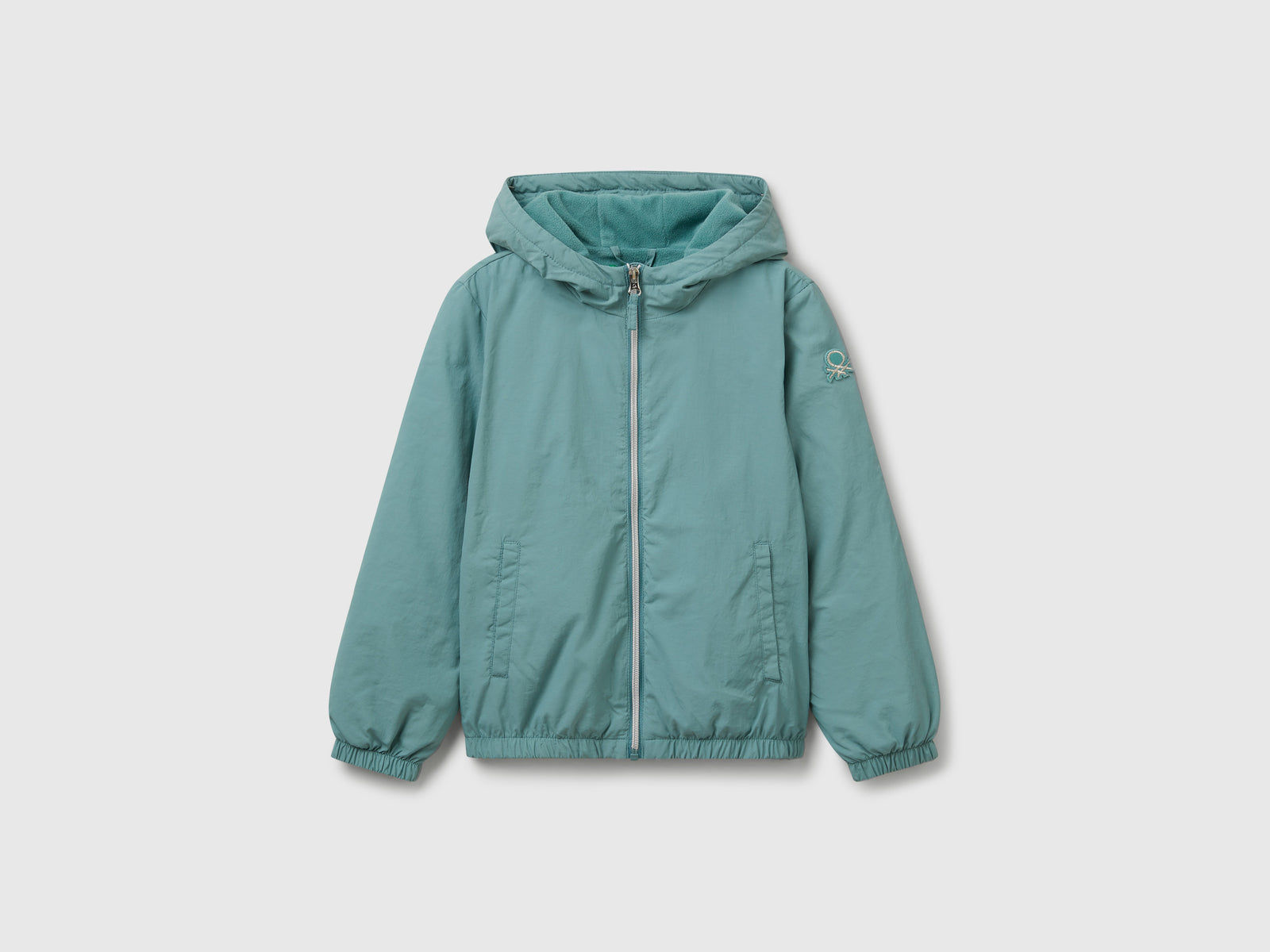 Giacca leggera "Rain Defender" da bambina celeste | Benetton Outlet