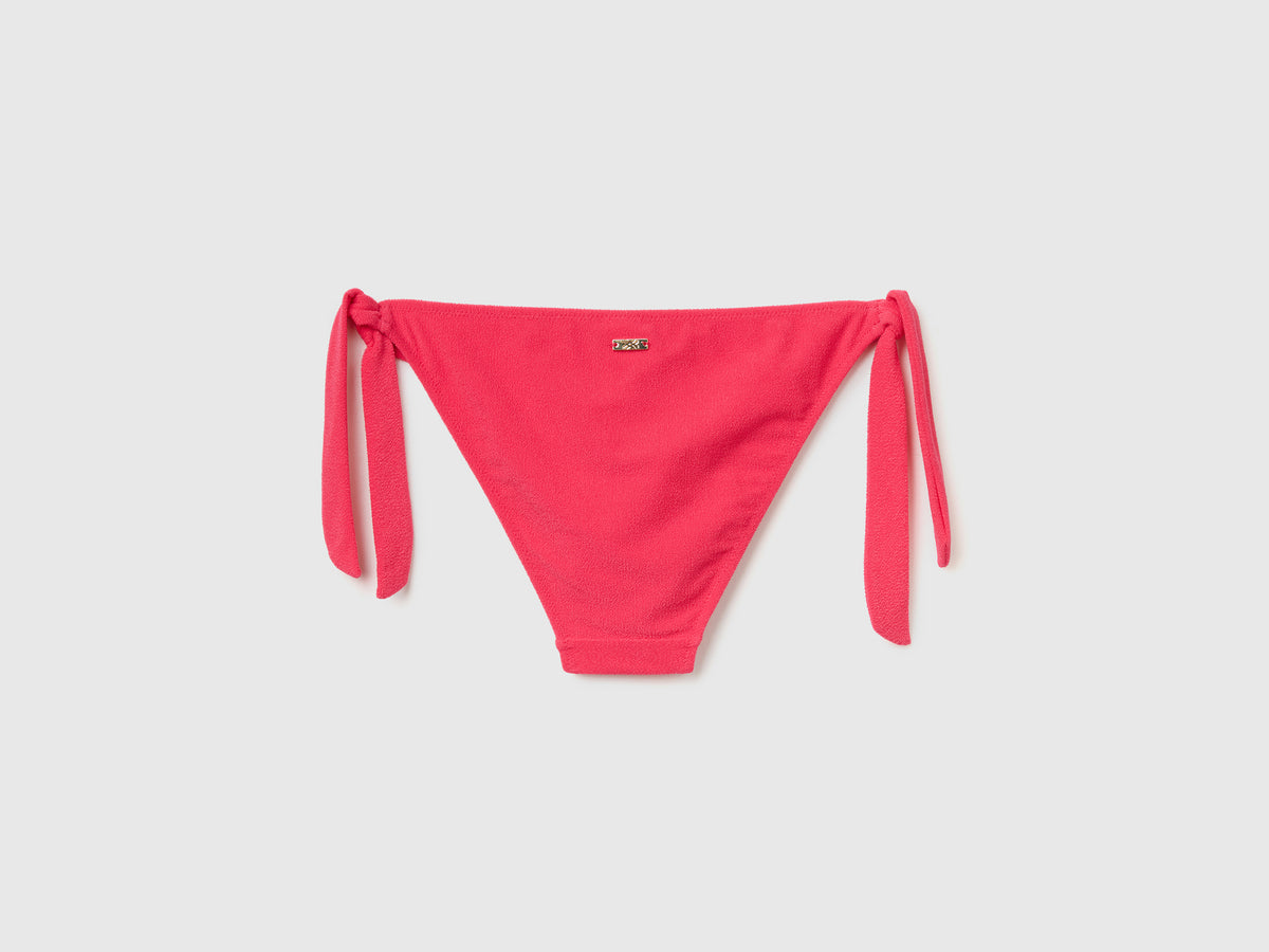 Slip mare con fiocchi sui fianchi in tessuto elasticizzato effetto spugna