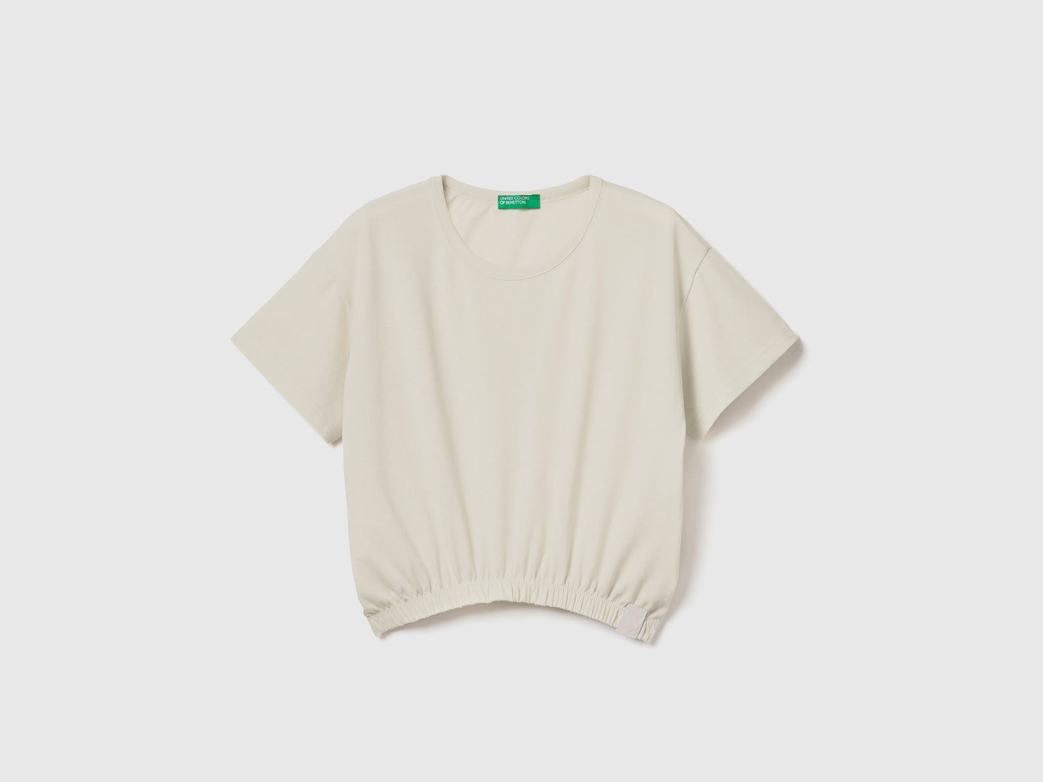 T-shirt stondata boxy fit con girocollo da bambina bianco panna | Benetton Outlet
