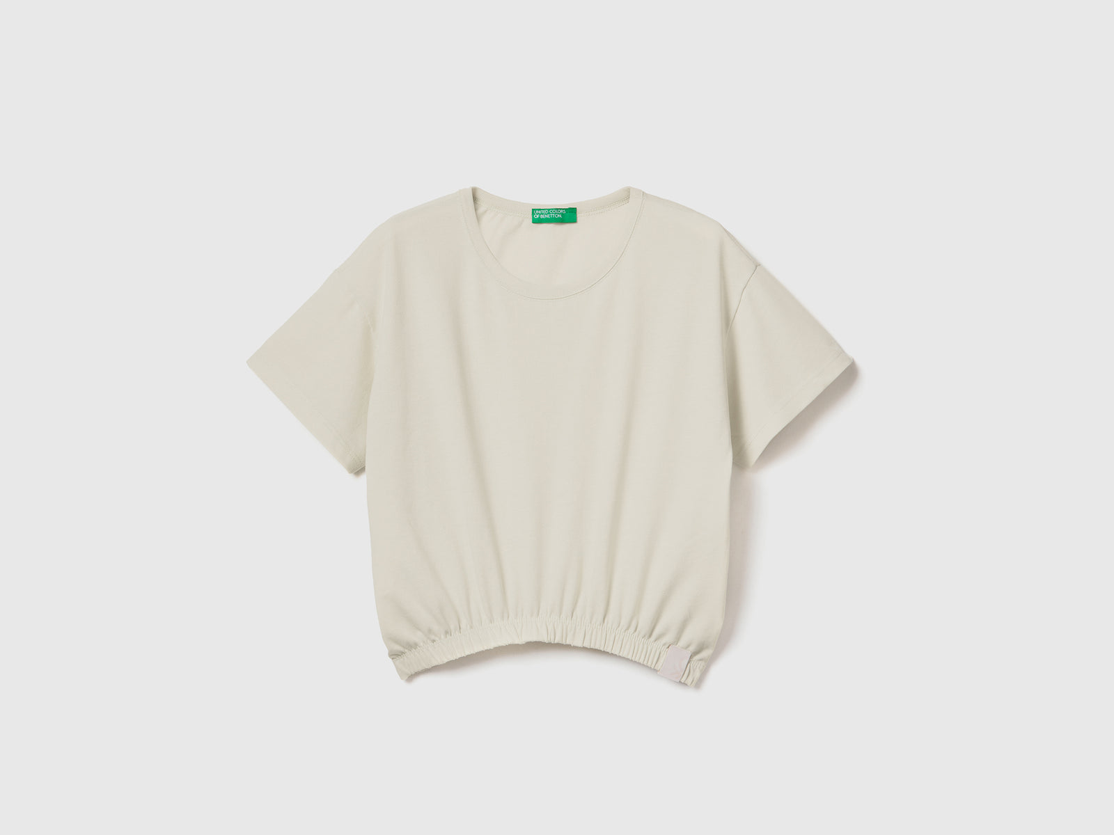 T-shirt stondata boxy fit con girocollo da bambina bianco panna | Benetton Outlet