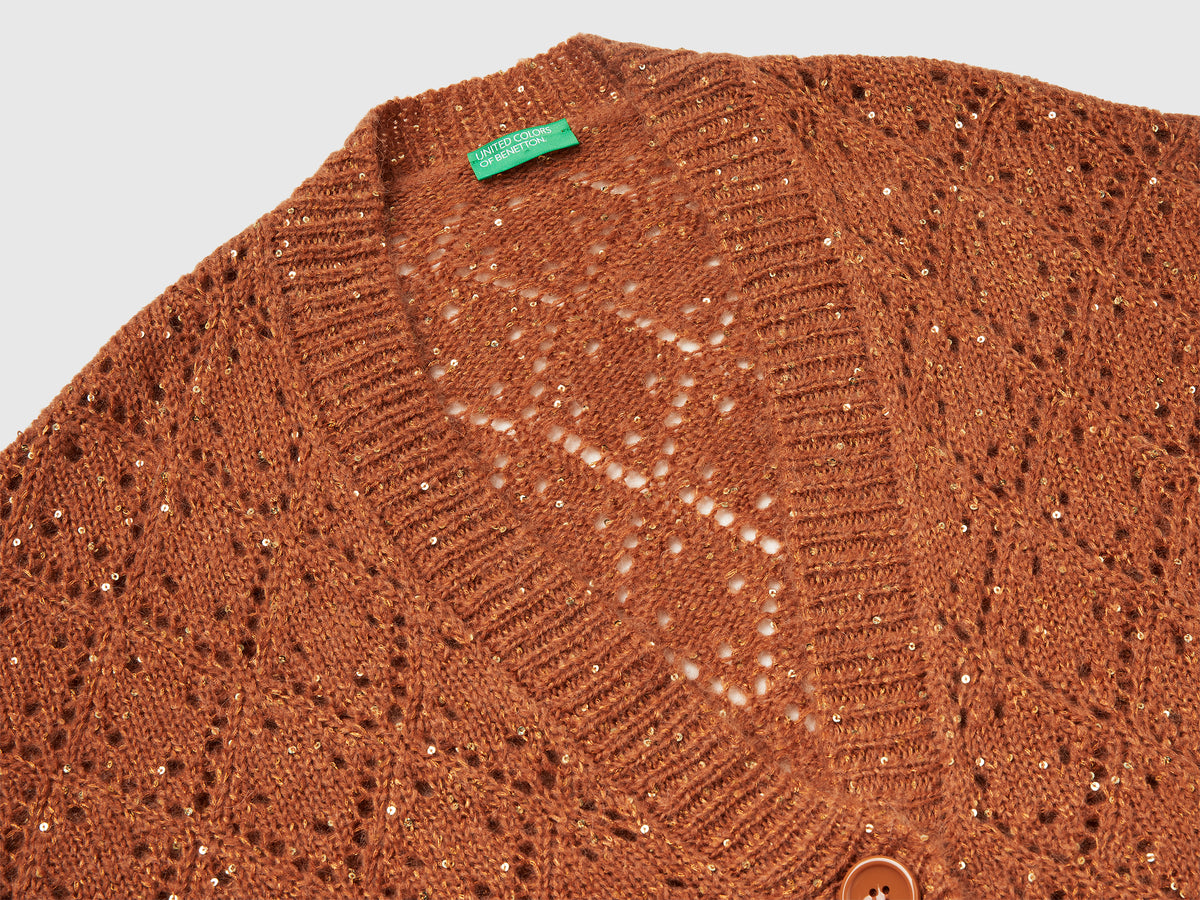 Cardigan traforato con paillettes