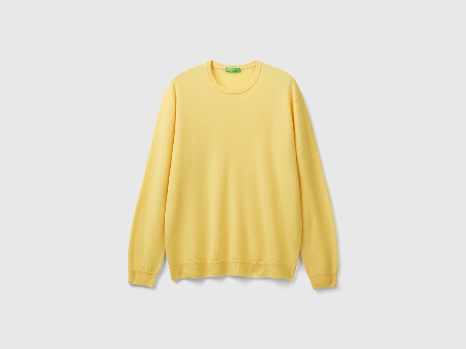 Maglia girocollo in pura lana Merino da uomo giallo | Benetton Outlet