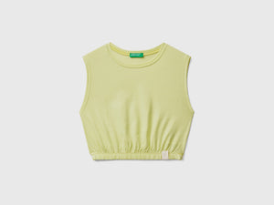 Top corto smanicato con scollo rotondo ed elastico interno sul fondo