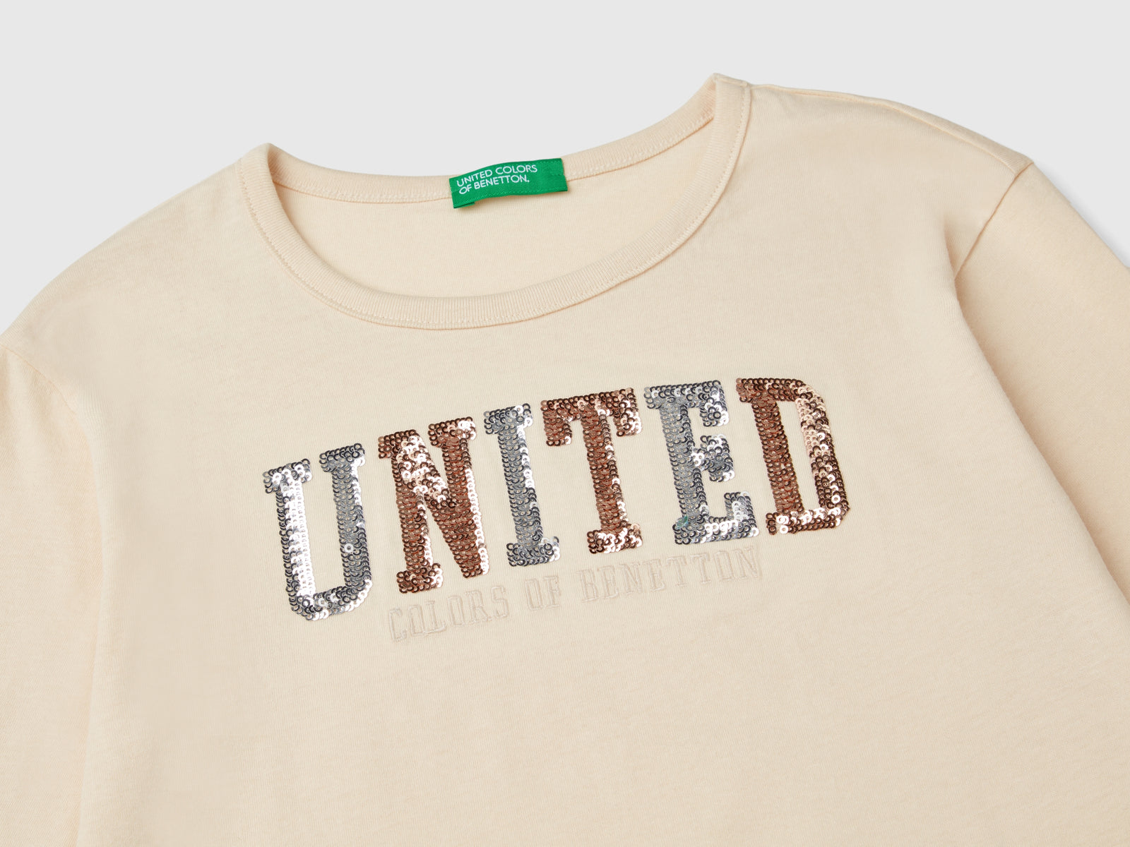 T-shirt in caldo cotone bio con paillettes da bambina bianco panna 3 | Benetton Outlet