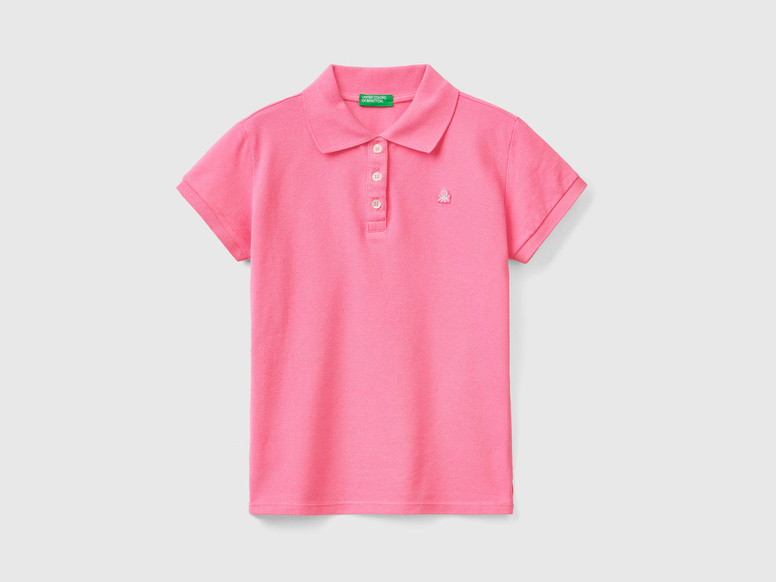 Polo a manica corta in piquet di cotone elasticizzato da bambina rosa | Benetton Outlet