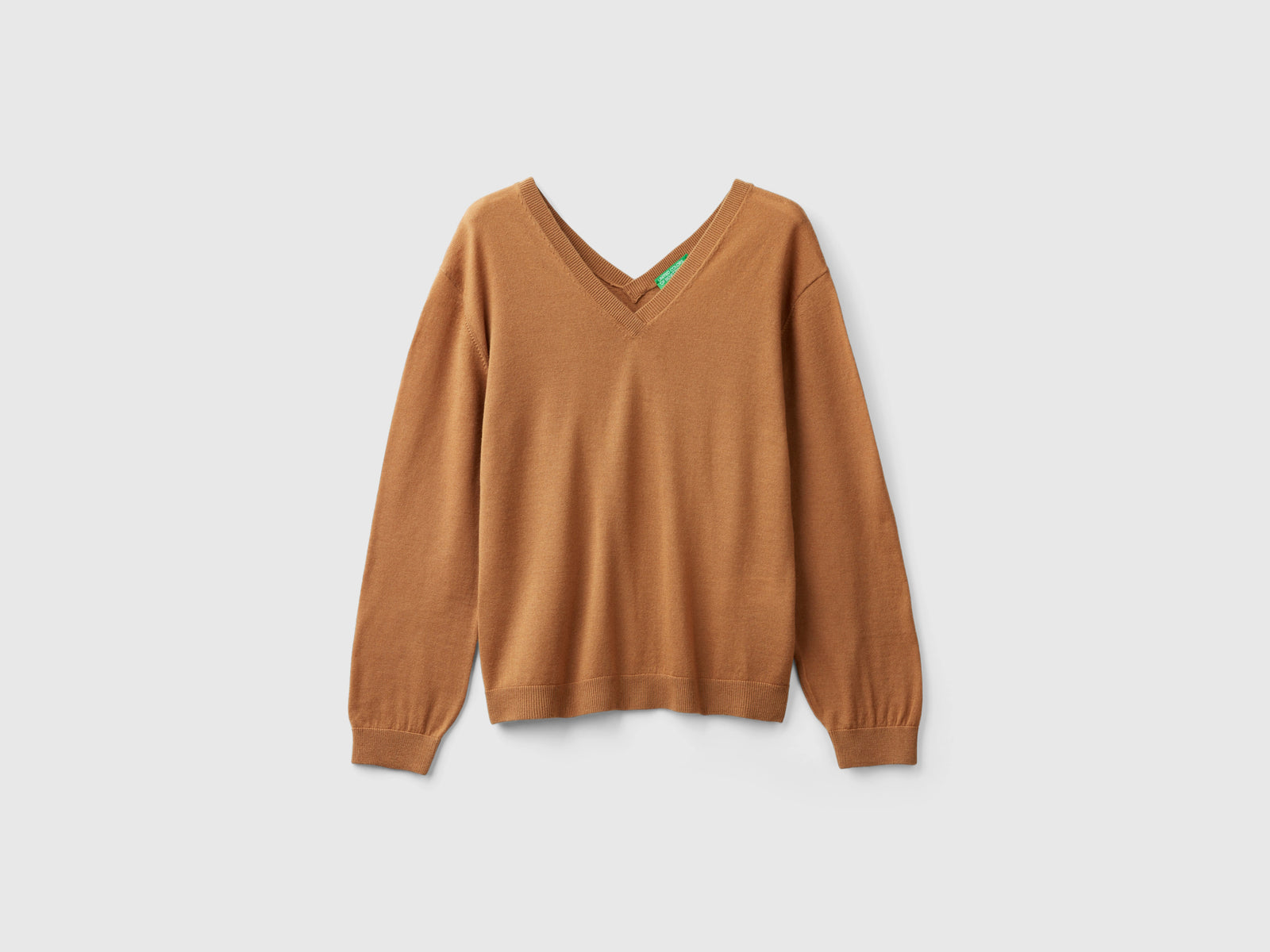 Maglia scollo a V in pura lana Merino da donna cammello | Benetton Outlet