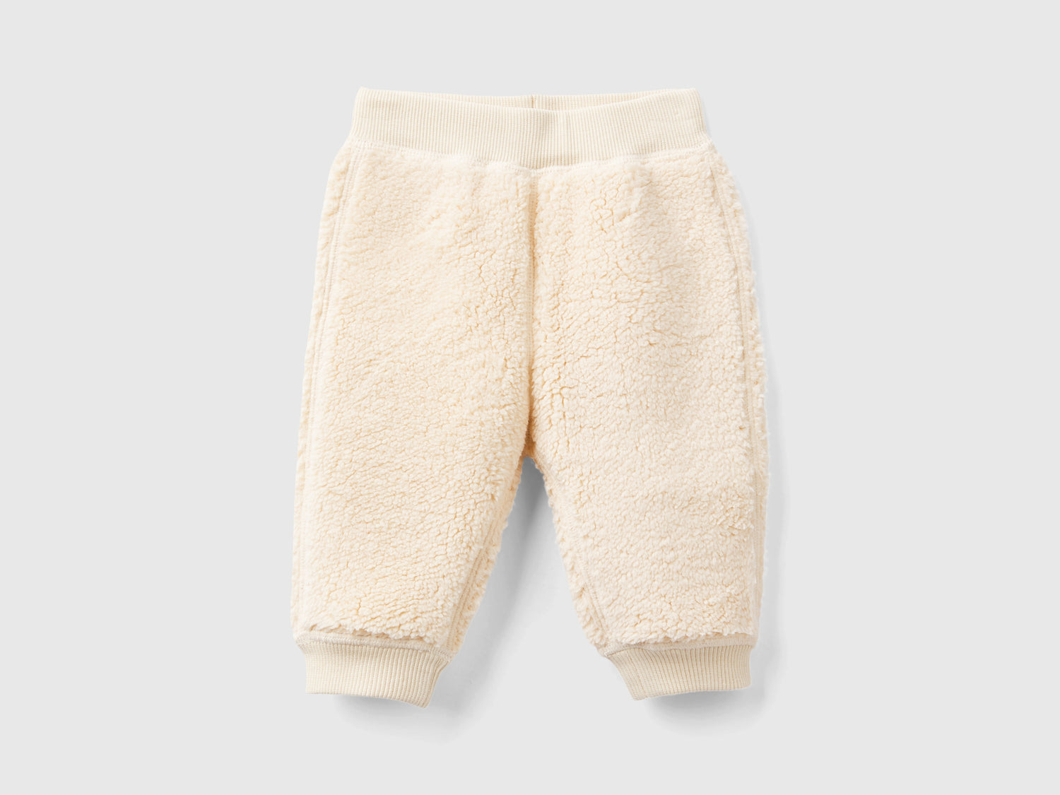 Pantaloni reversibili con coniglietti da neonato beige | Benetton Outlet