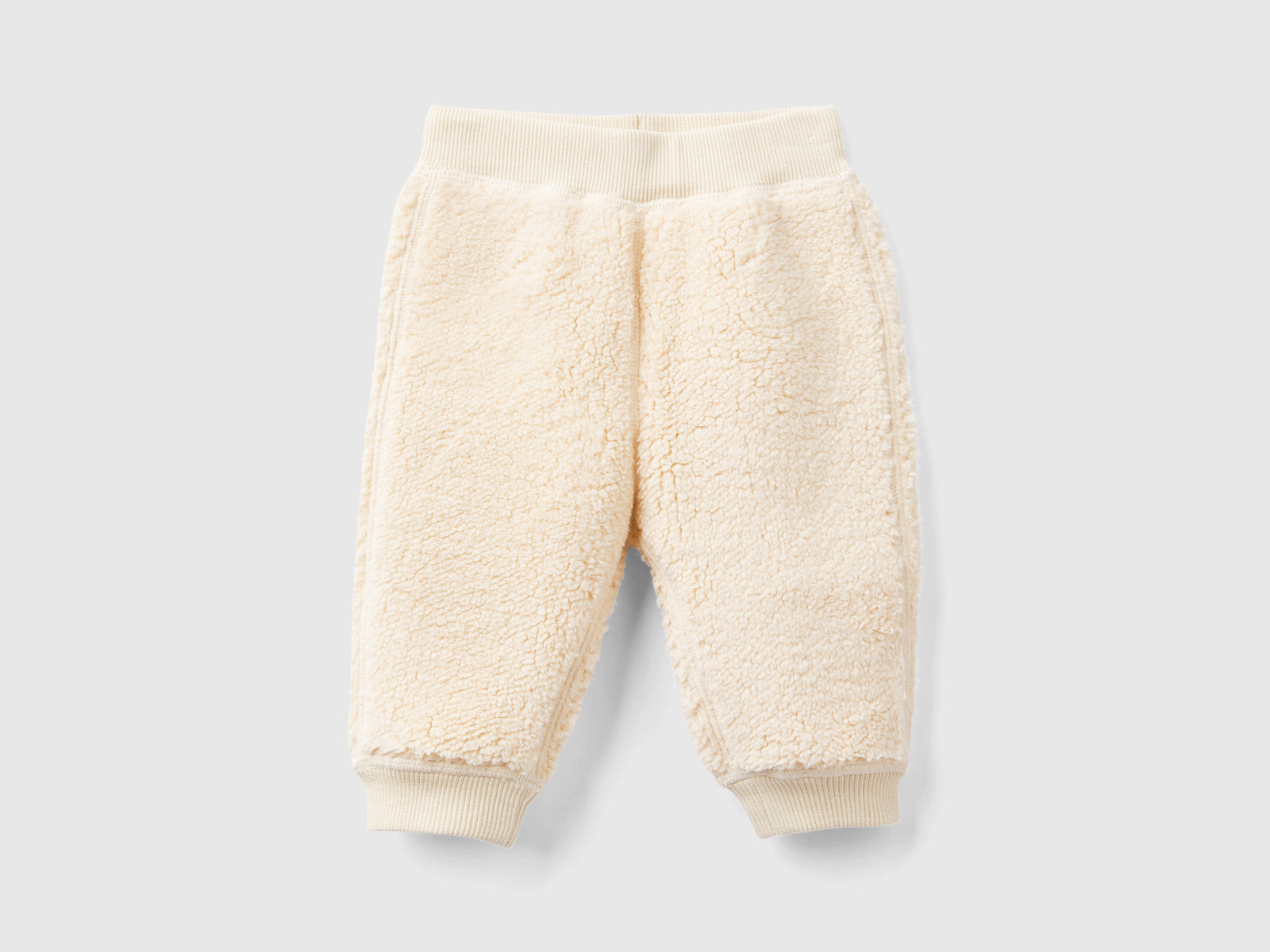 Pantaloni reversibili con coniglietti da neonato beige | Benetton Outlet