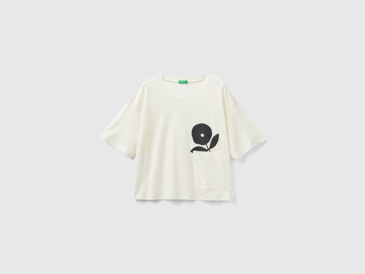 T-shirt boxy fit con fiore da donna bianco panna | Benetton Outlet