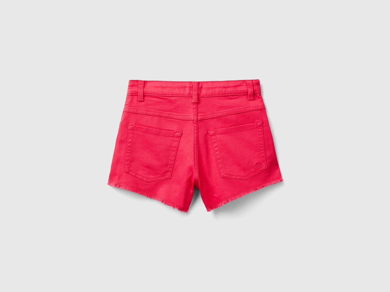 Shorts sfrangiati in cotone stretch da bambina fucsia 2 | Benetton Outlet