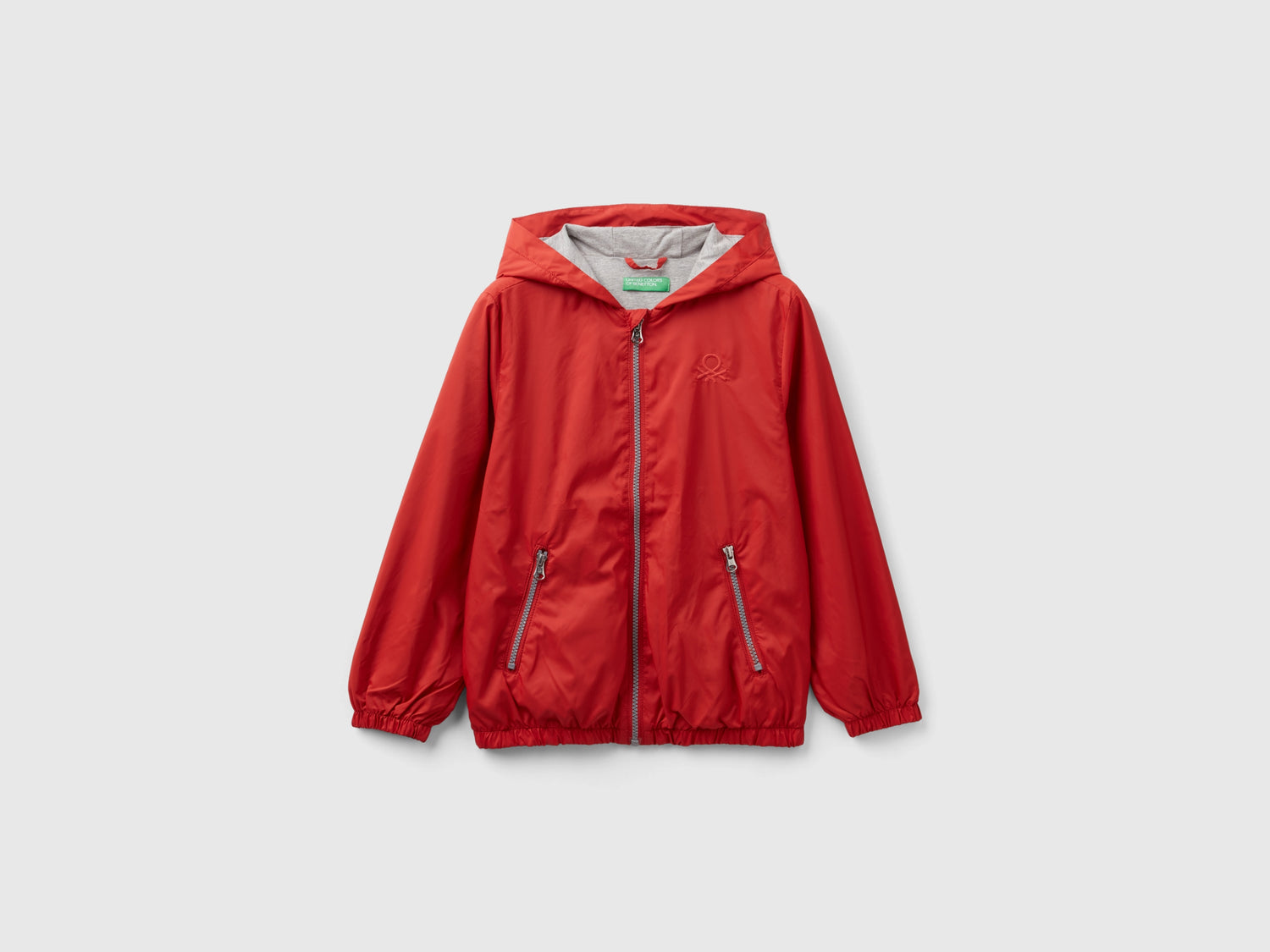 Giubbino in nylon con cappuccio da bambino rosso mattone | Benetton Outlet