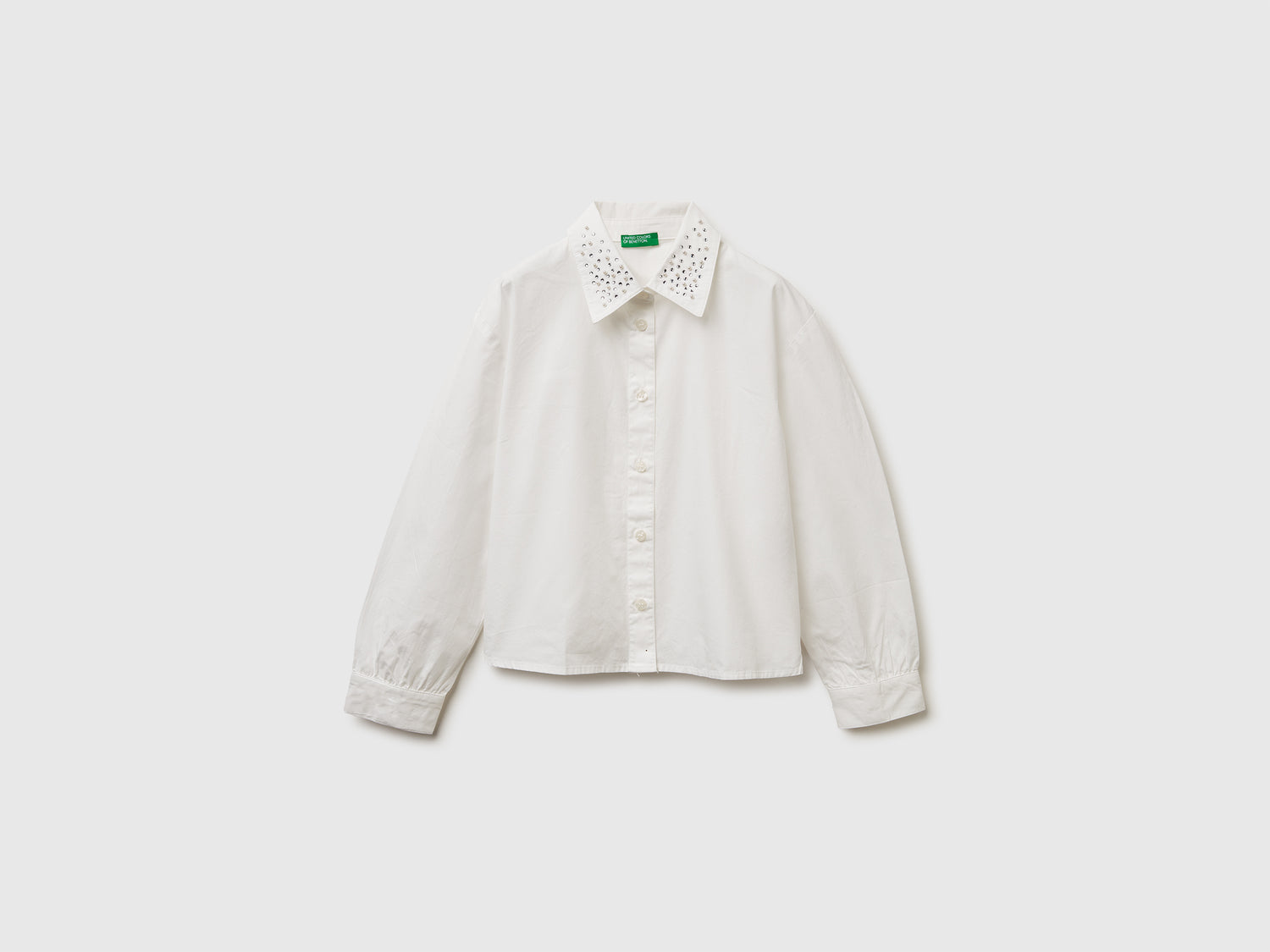 Camicia con applicazioni effetto gioiello da bambina bianco panna | Benetton Outlet