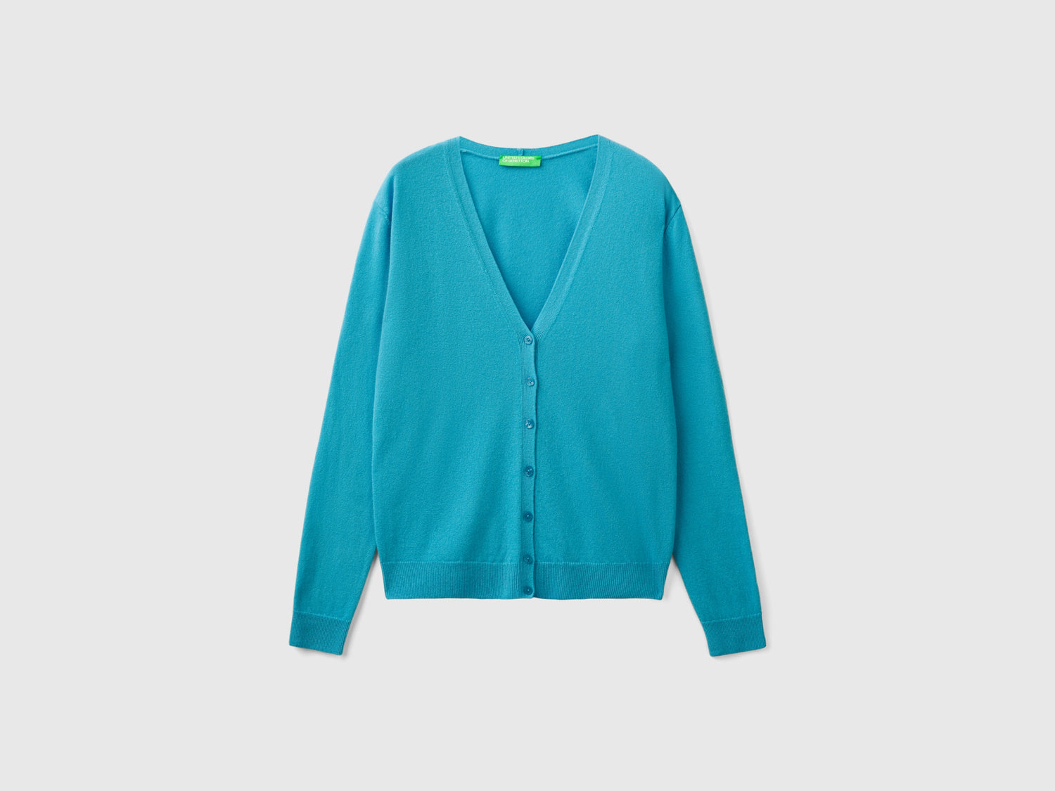 Cardigan scollo a V in pura lana Merino da donna azzurro | Benetton Outlet