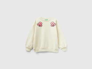 Felpa con patch fiori