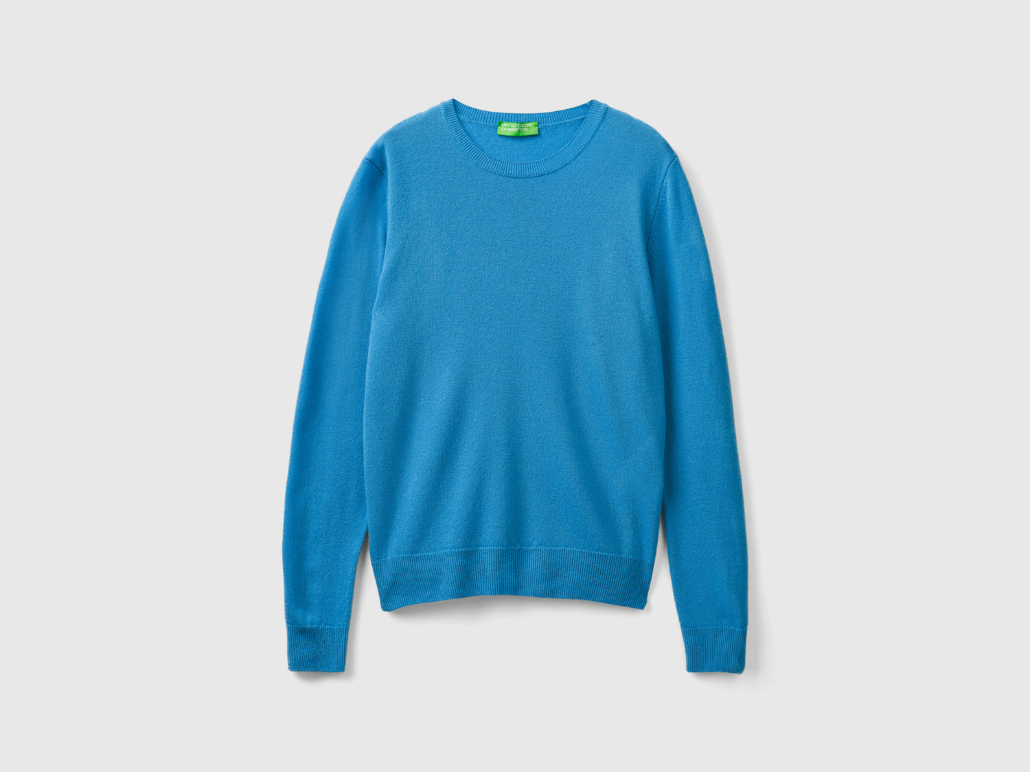 Maglia girocollo in pura lana Merino da donna azzurro | Benetton Outlet