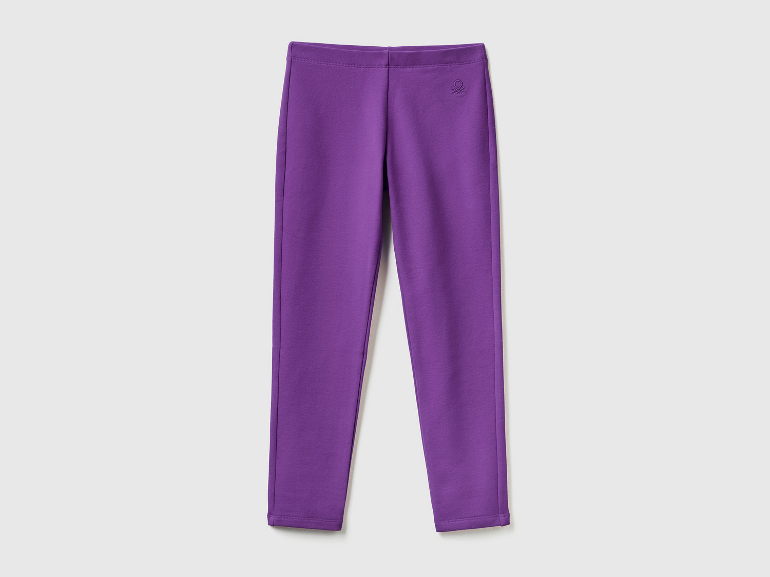 Leggings in felpa stretch da bambina viola | Benetton Outlet