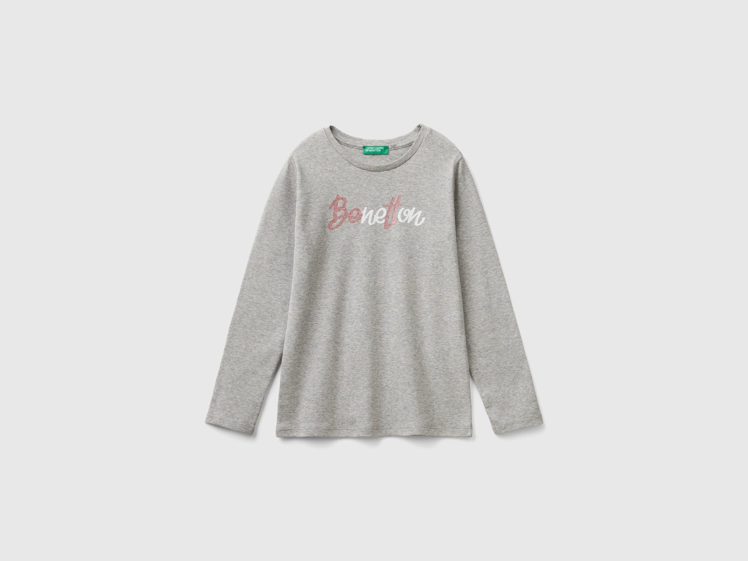 T-shirt manica lunga con stampa glitter da bambina grigio chiaro | Benetton Outlet